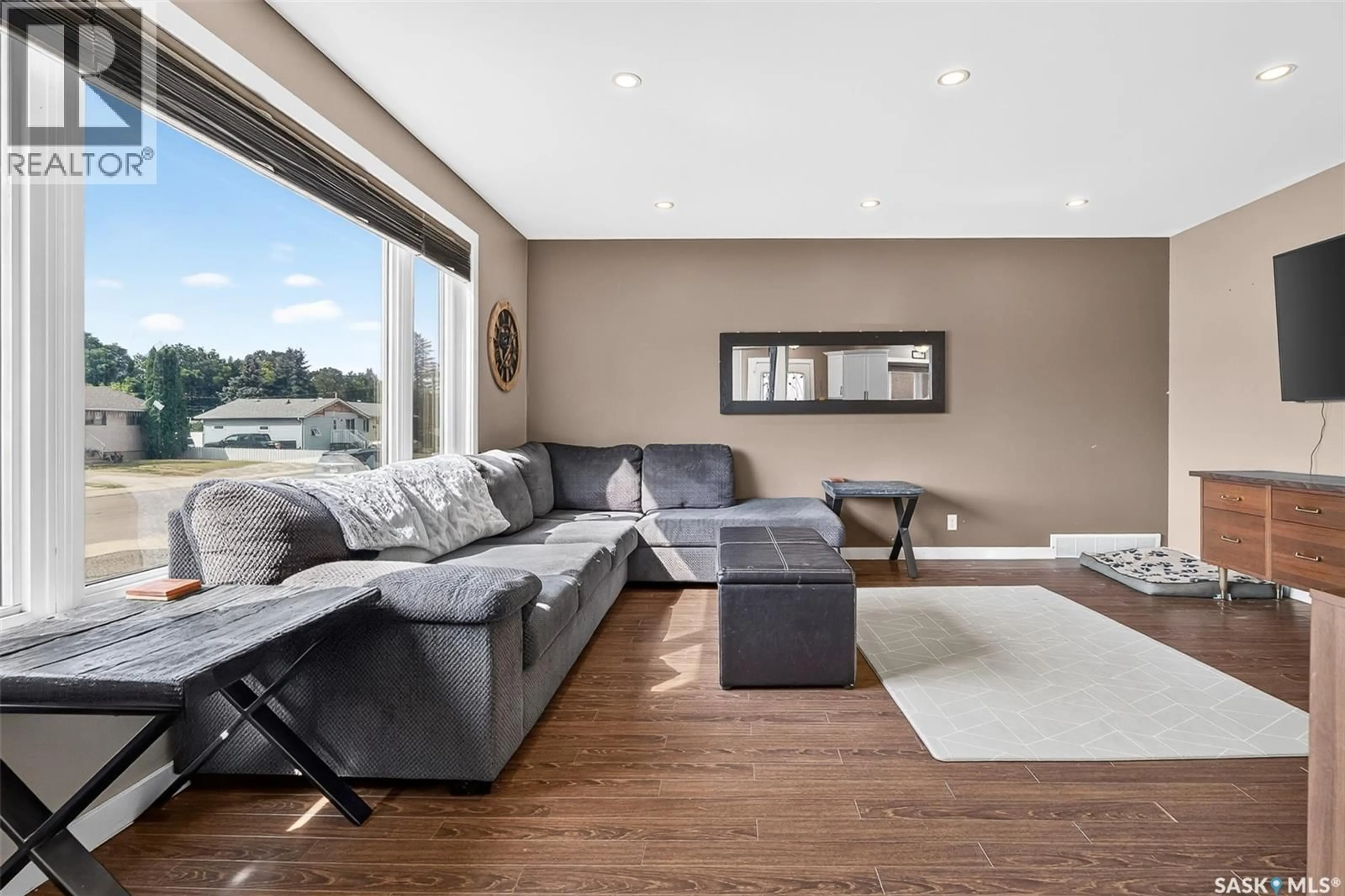 Living room with furniture, wood/laminate floor for 1214 GRANDVIEW STREET, Moose Jaw Saskatchewan S6H5M2
