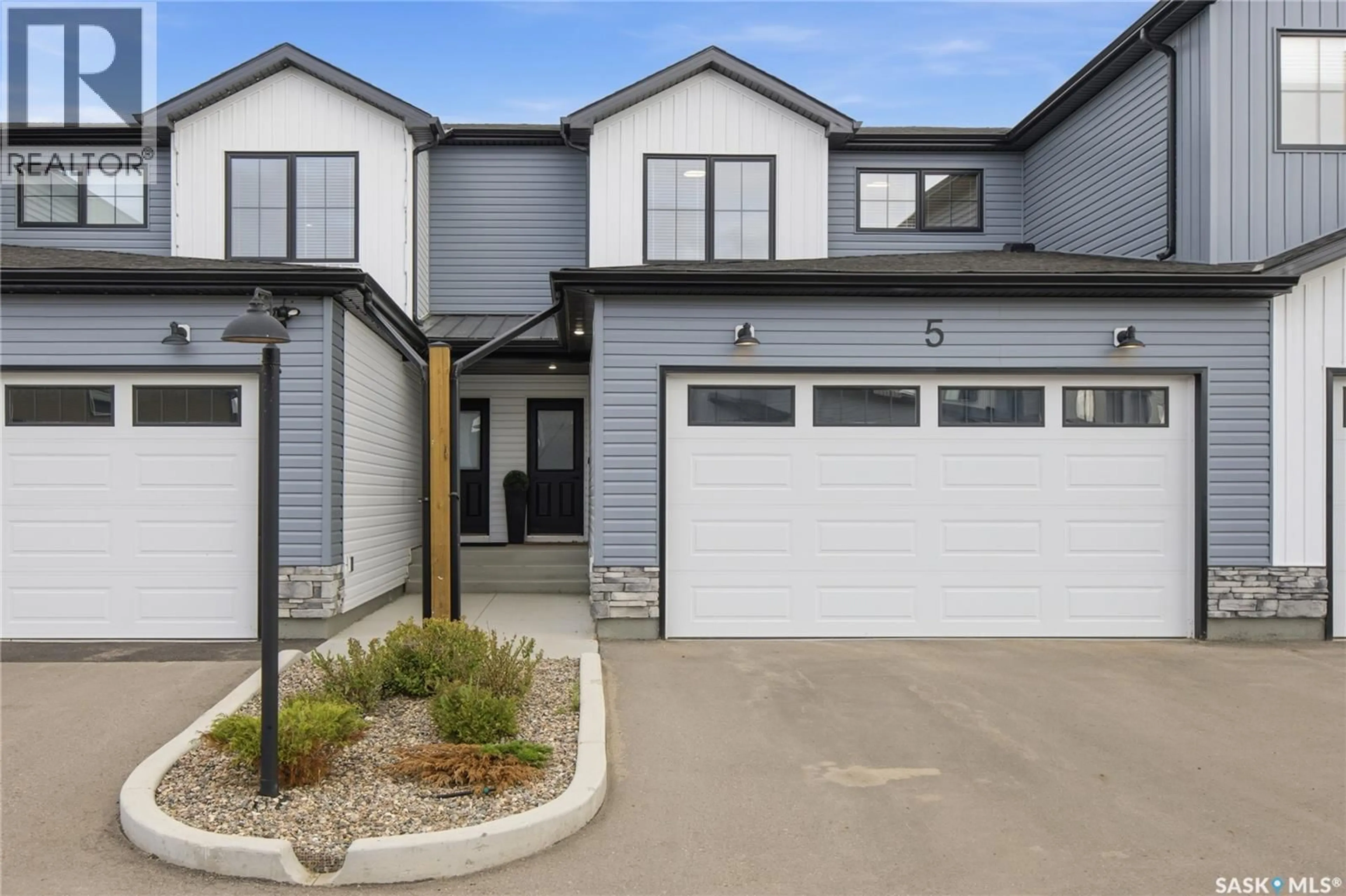 Home with vinyl exterior material, street for 5 - 625 DAGNONE CRESCENT, Saskatoon Saskatchewan S7V1K9