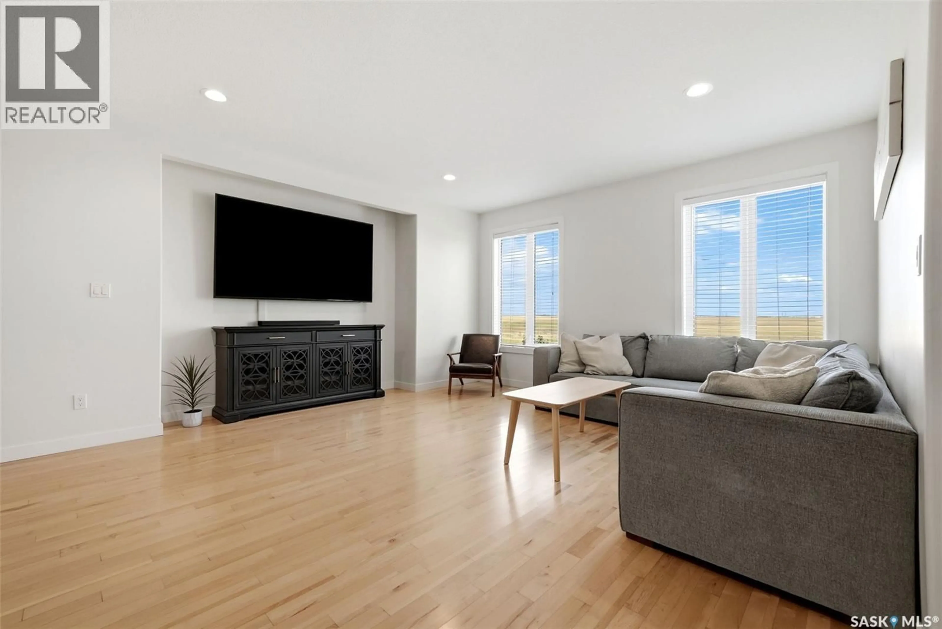 Living room with furniture, wood/laminate floor for 23 CENTENNIAL DRIVE, Grand Coulee Saskatchewan S4M0A3