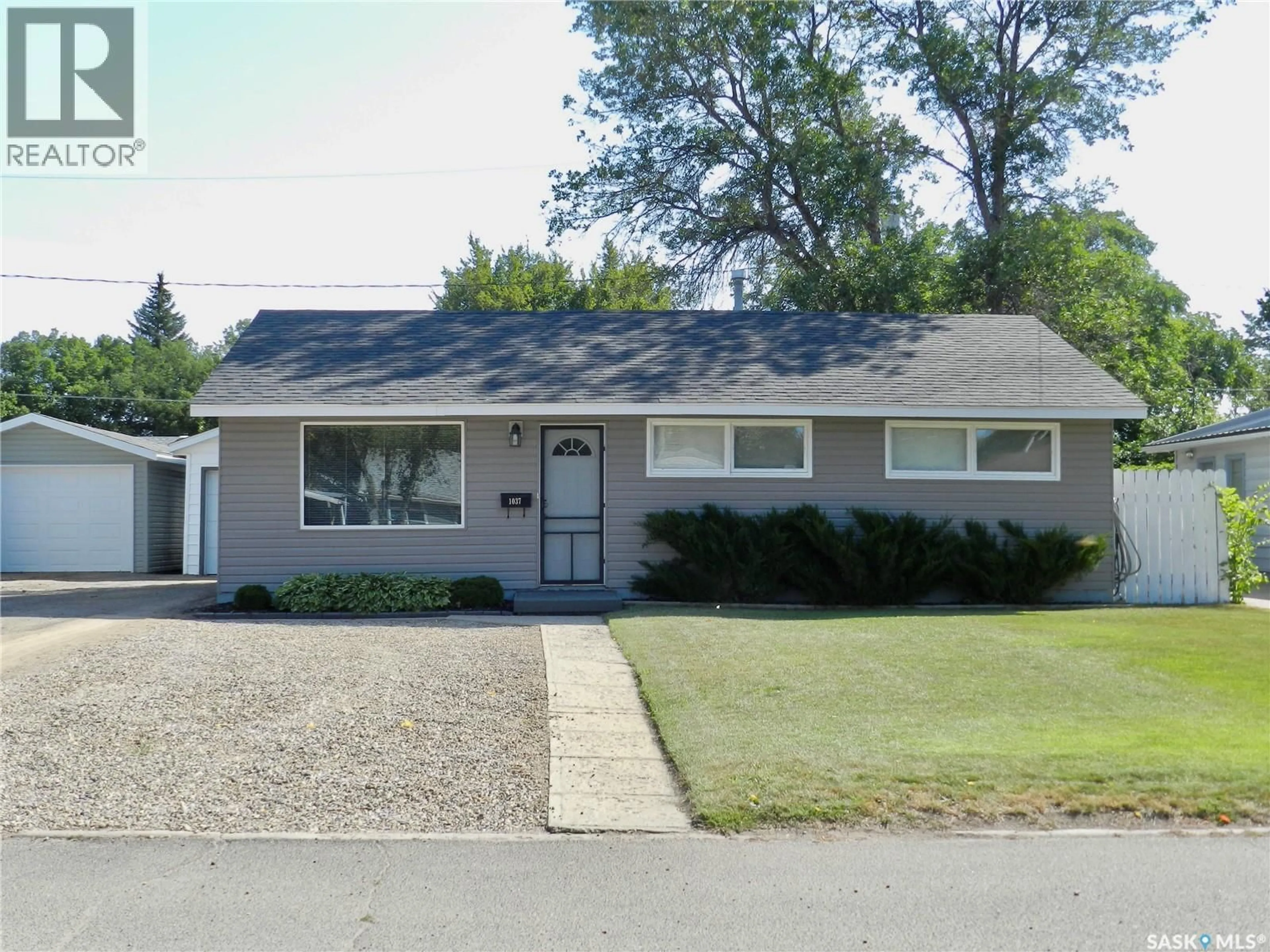 Home with vinyl exterior material, street for 1037 BOGUE AVENUE, Moose Jaw Saskatchewan S6H4M4