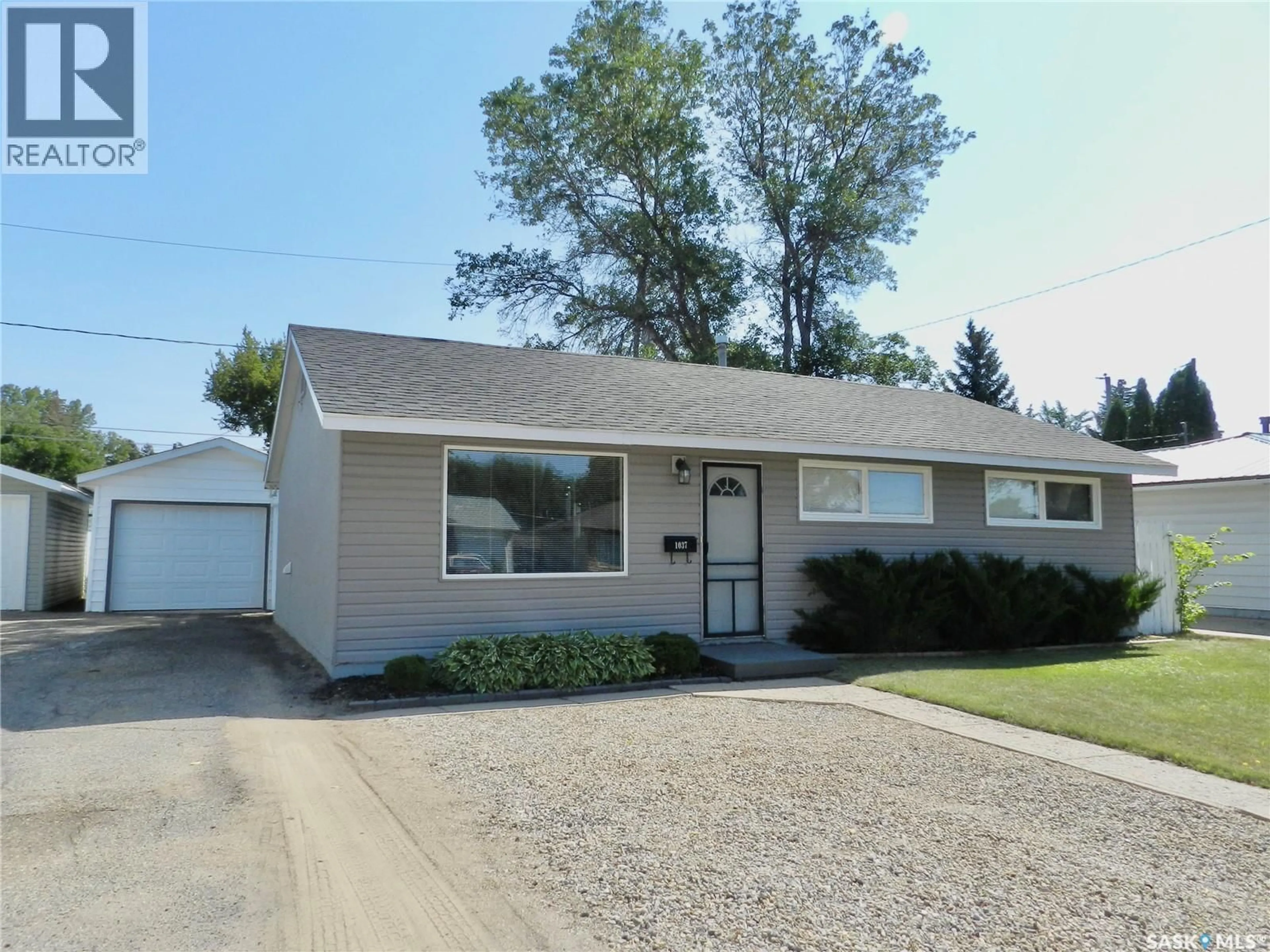 Home with vinyl exterior material, street for 1037 BOGUE AVENUE, Moose Jaw Saskatchewan S6H4M4