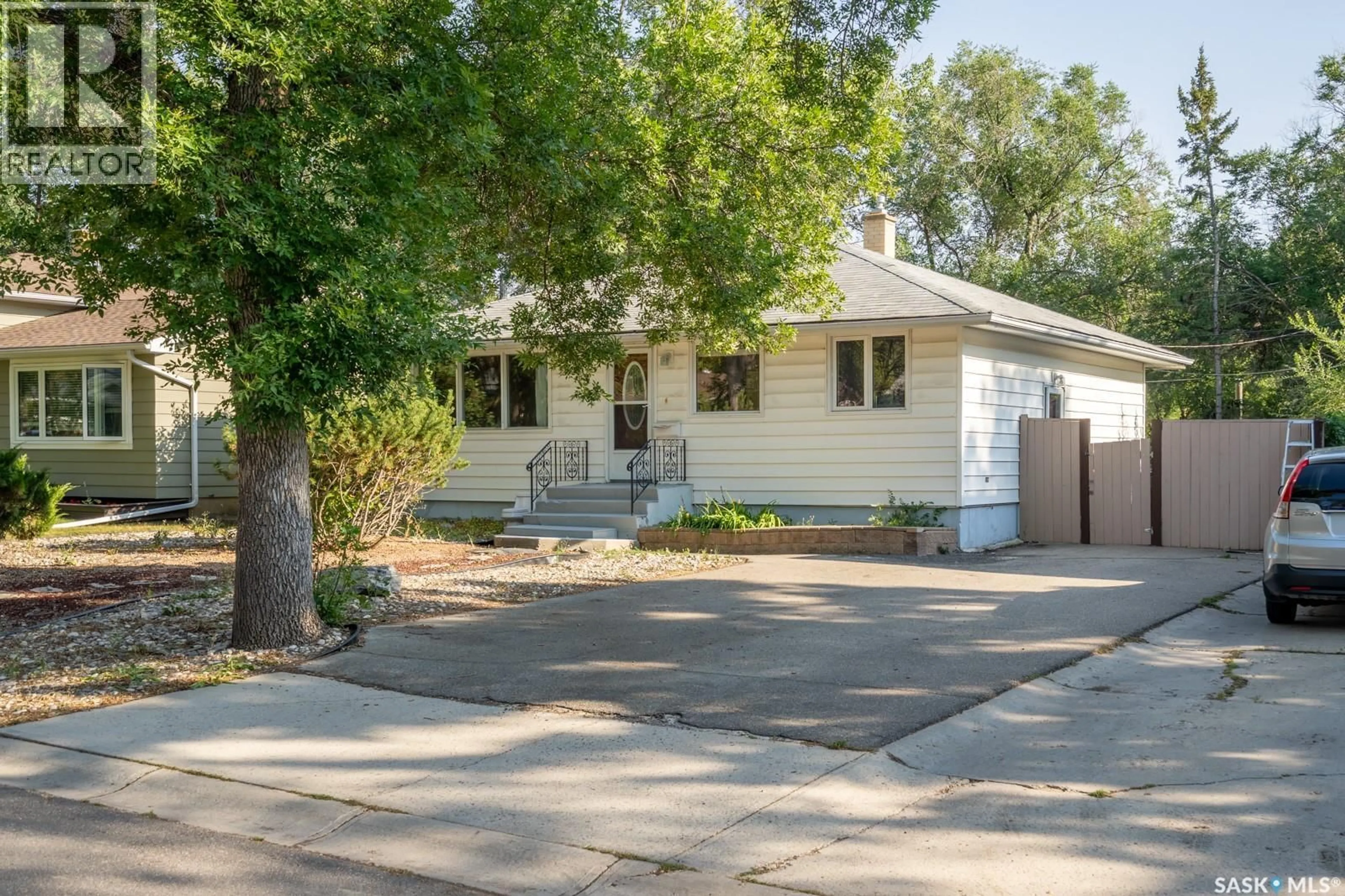 Home with vinyl exterior material, street for 237 ORCHARD CRESCENT, Regina Saskatchewan S4S5B9
