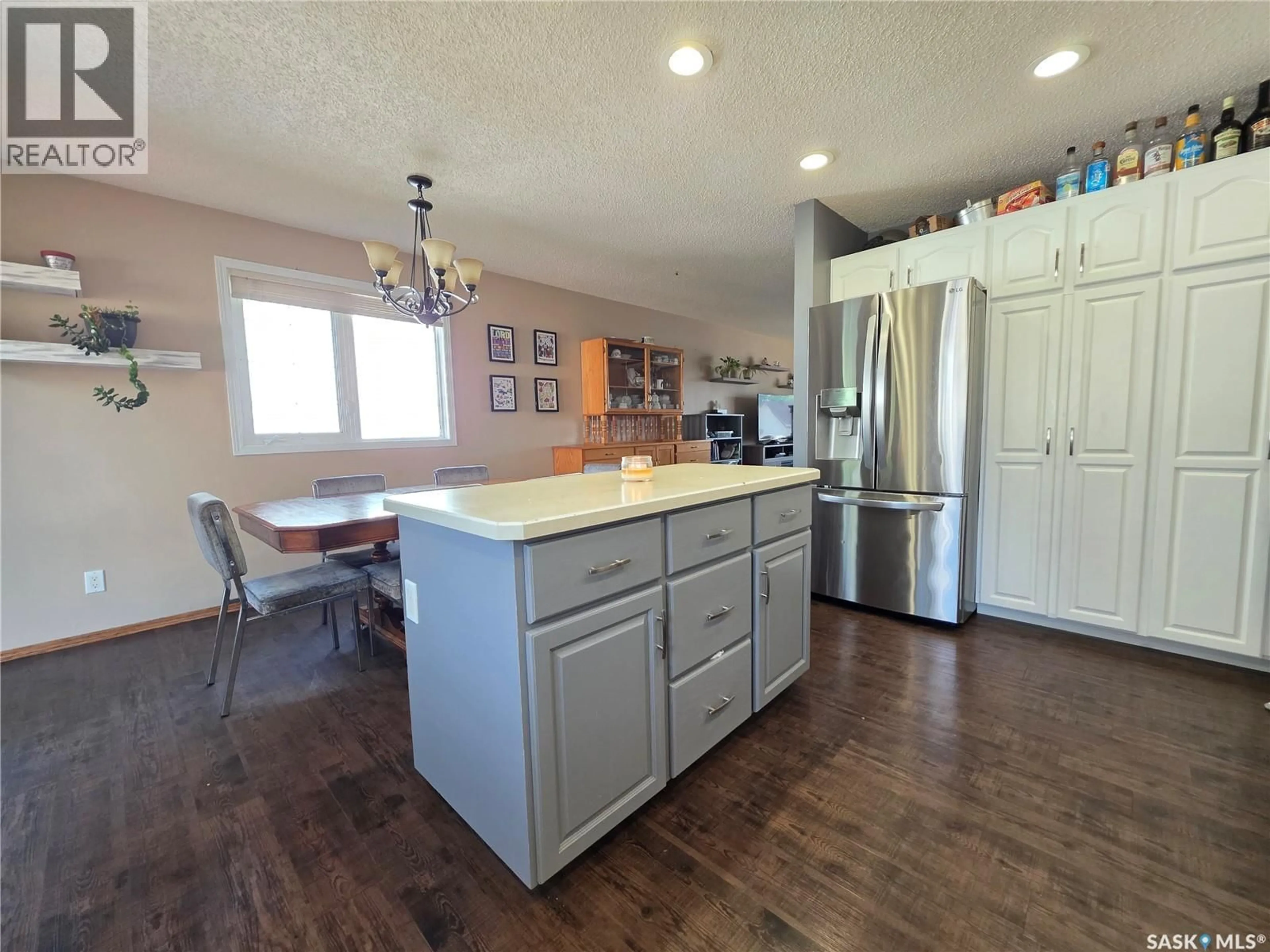 Open concept kitchen, wood/laminate floor for 528 ANNABLE STREET, Herbert Saskatchewan S0H2A0