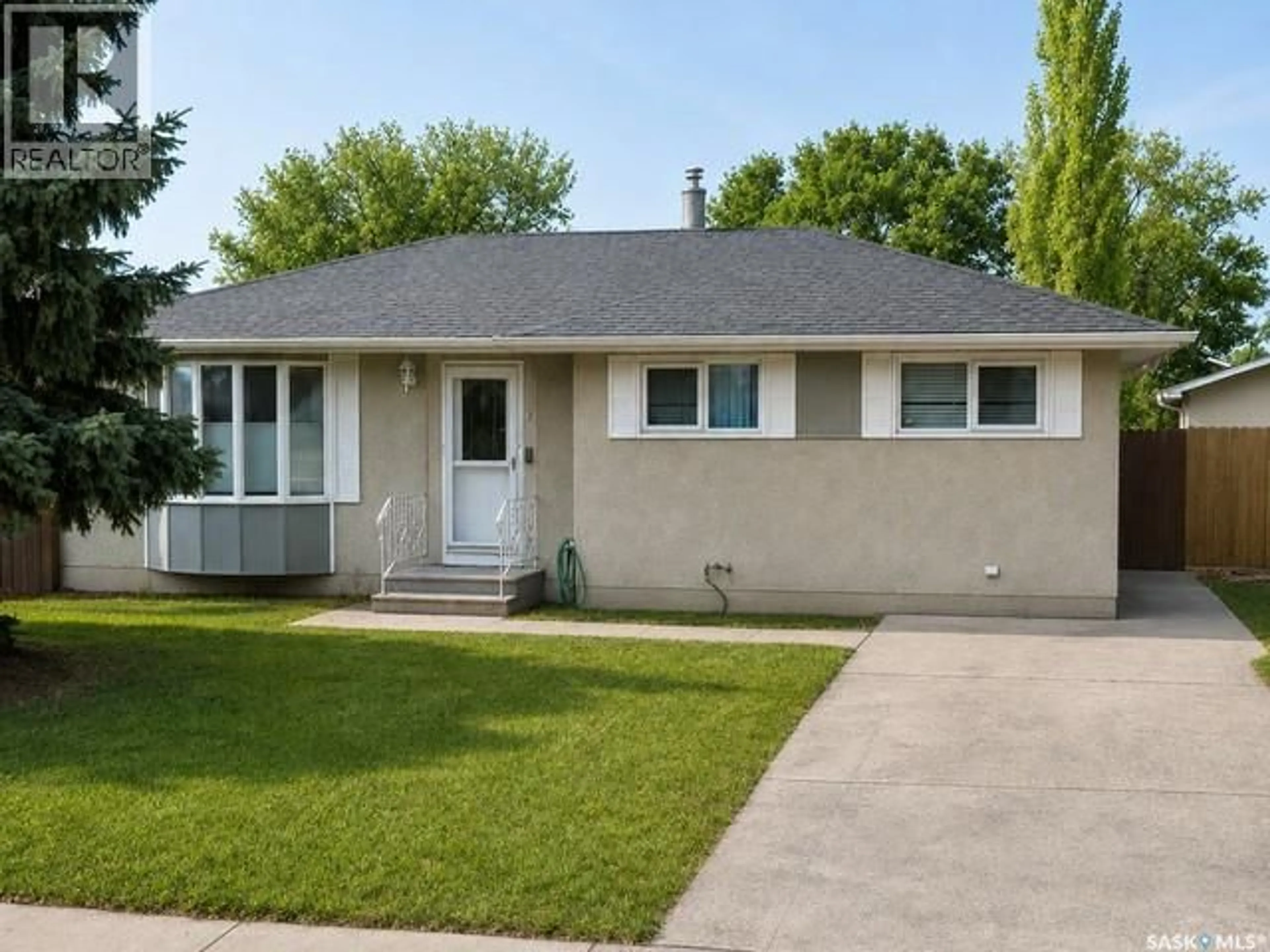 Home with vinyl exterior material, street for 445 WINNIPEG AVENUE, Saskatoon Saskatchewan S7M3M6