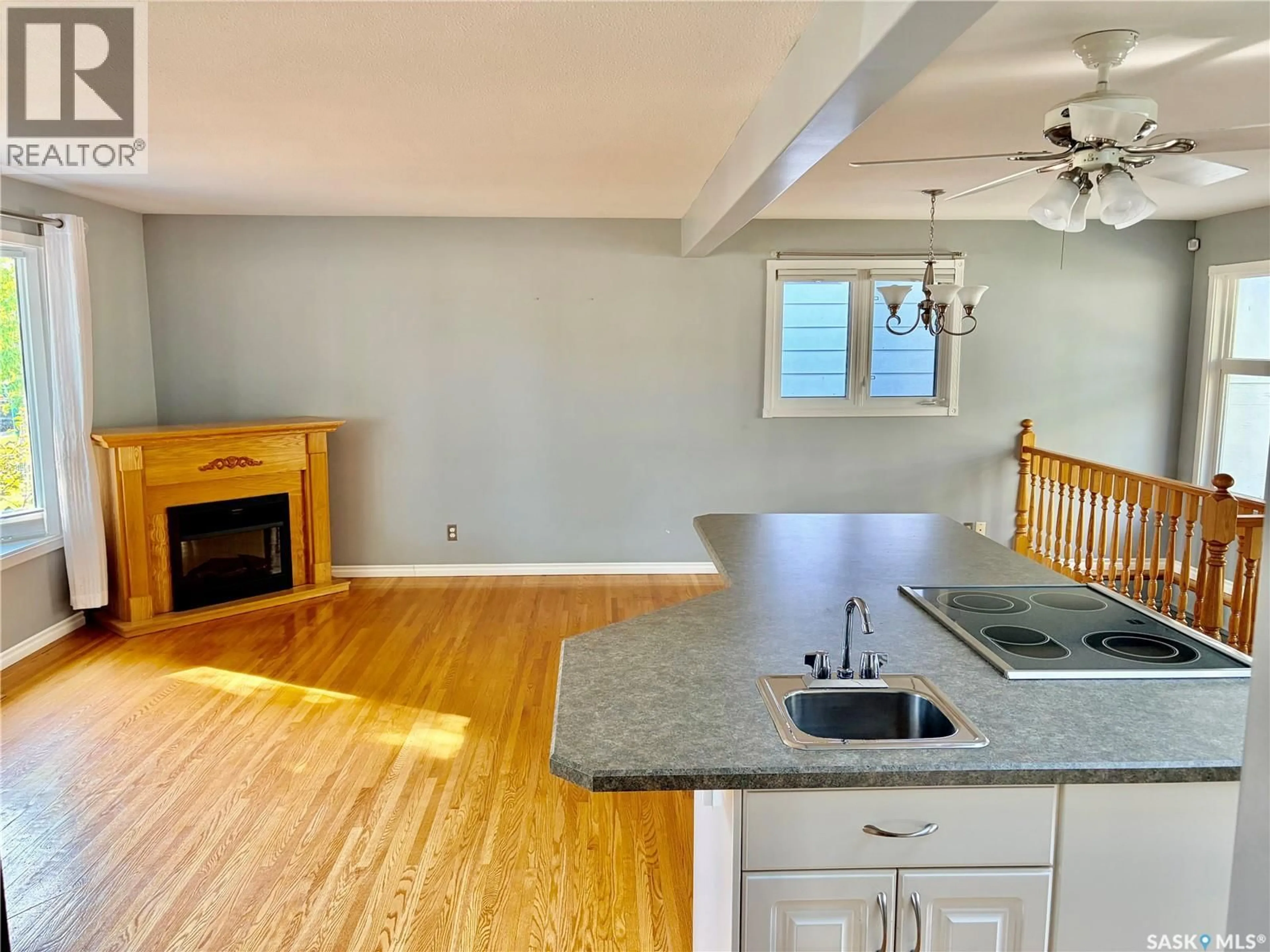 Open concept kitchen, wood/laminate floor for 445 WINNIPEG AVENUE, Saskatoon Saskatchewan S7M3M6