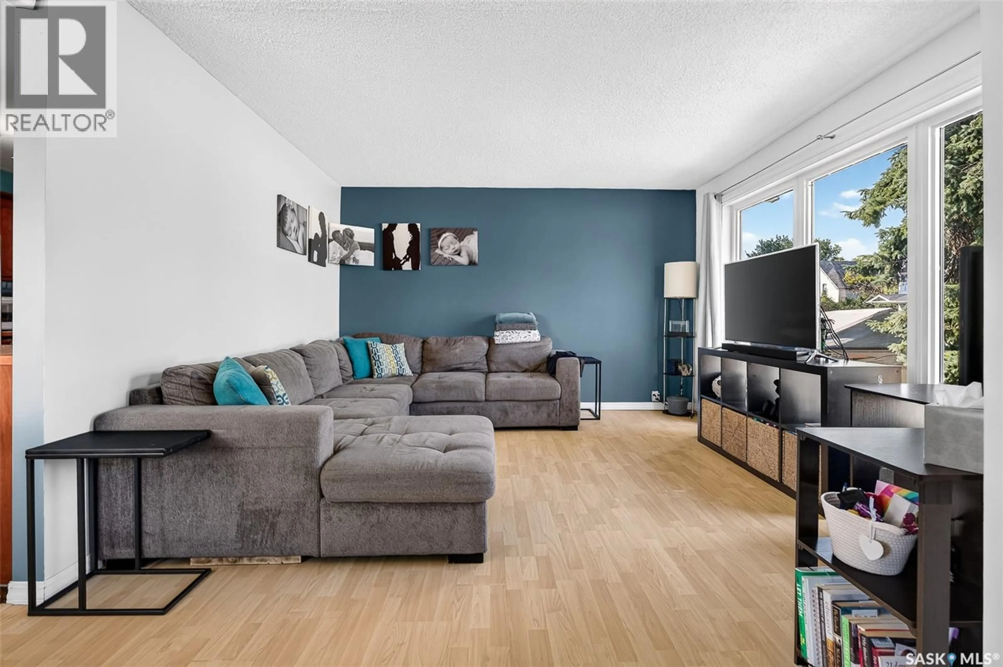 Living room with furniture, wood/laminate floor for 529 ATHABASCA STREET, Moose Jaw Saskatchewan S6H2C5