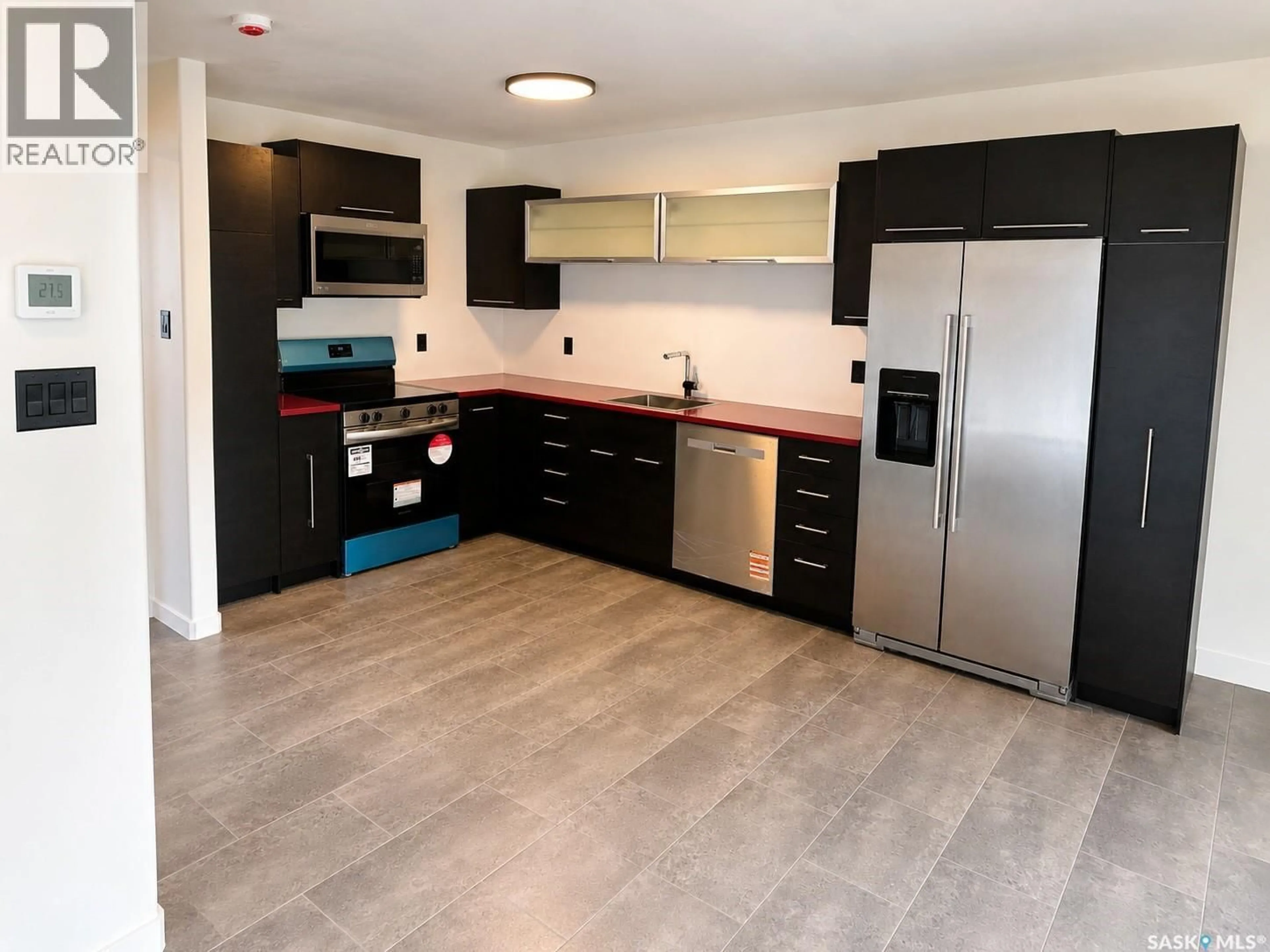 Open concept kitchen, ceramic/tile floor for 905A ARGYLE AVENUE, Saskatoon Saskatchewan S7H2V9