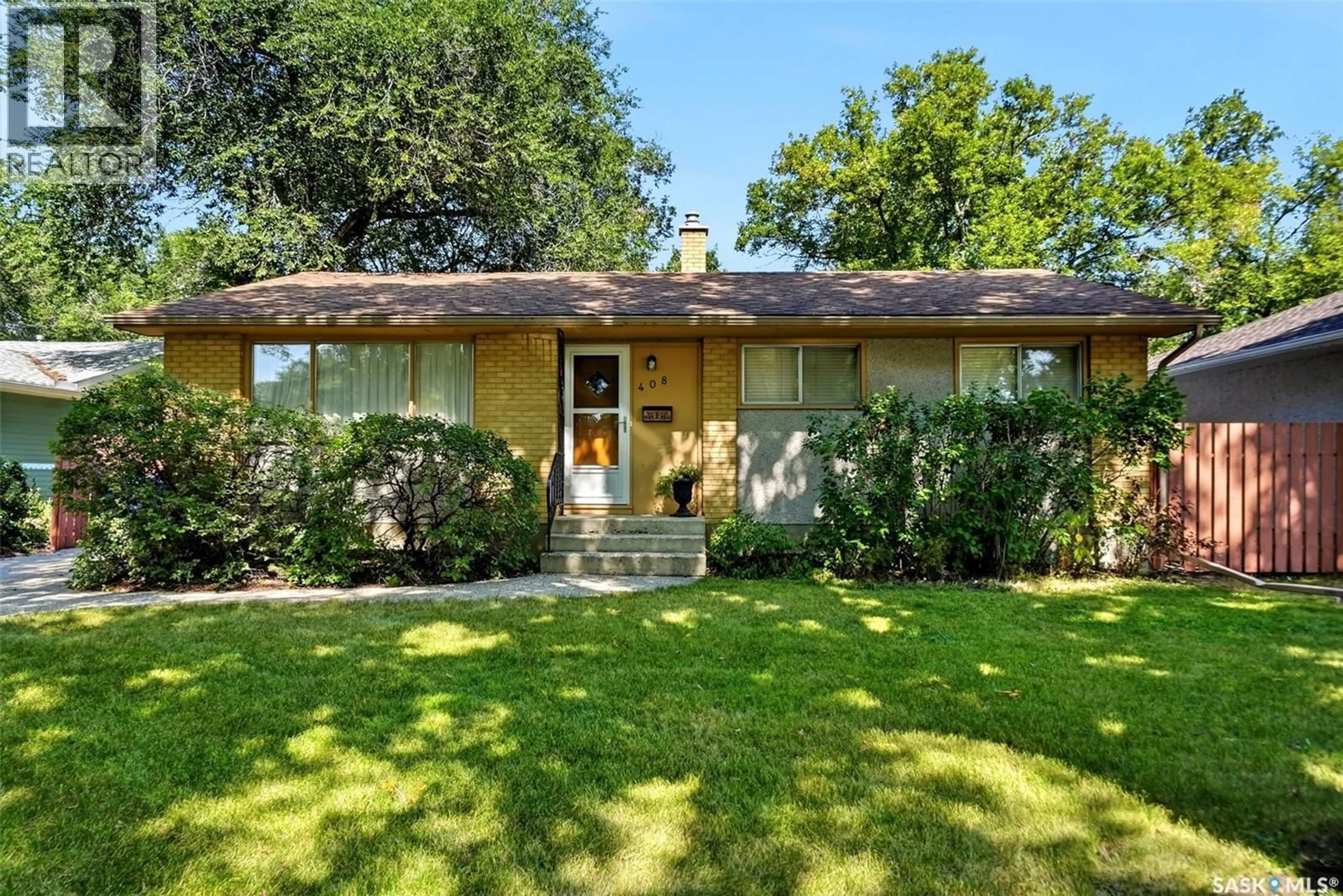 Home with vinyl exterior material, street for 408 SHANNON ROAD, Regina Saskatchewan S4S5J3