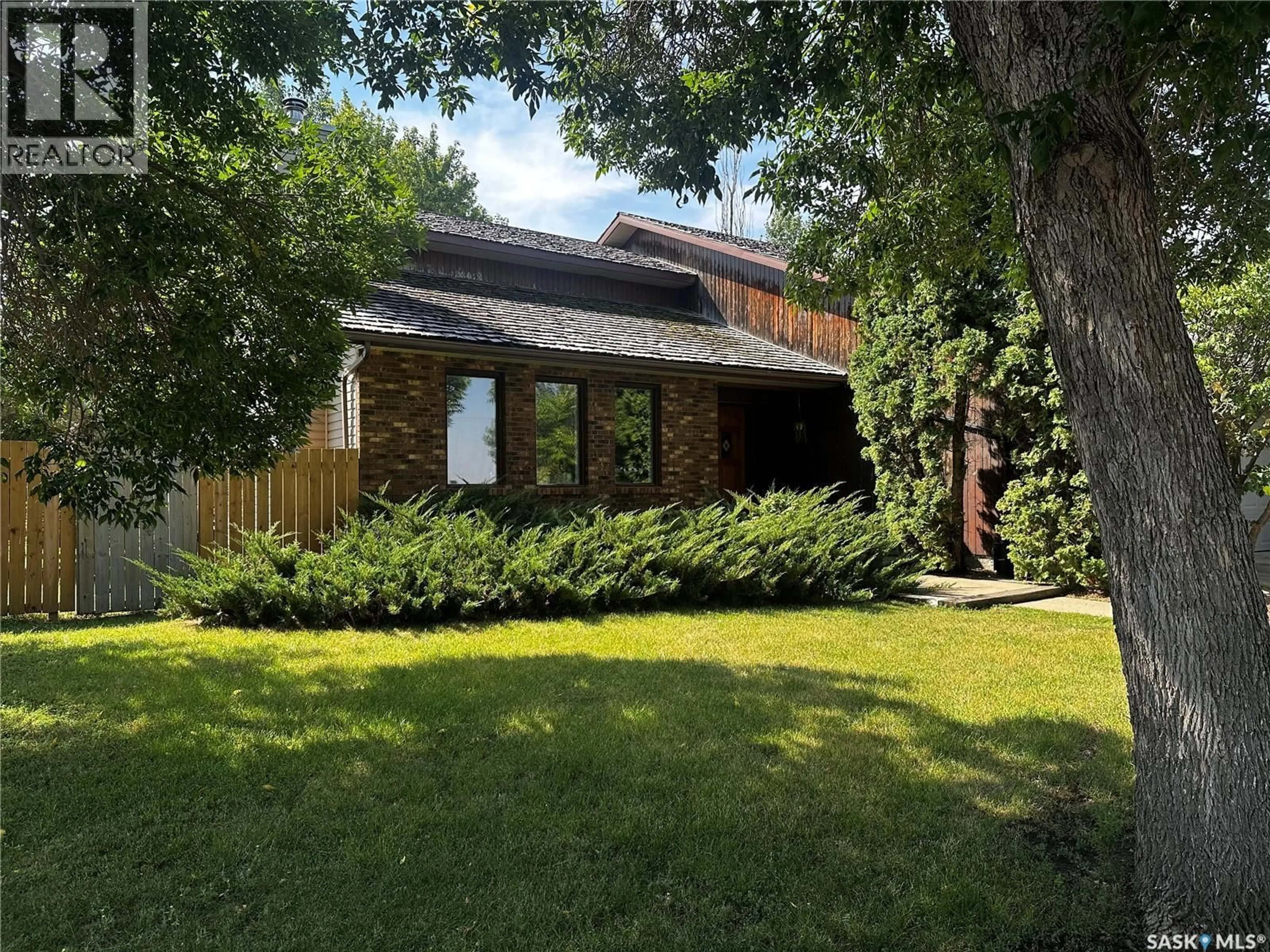 Home with brick exterior material, street for 895 BRIMACOMBE DRIVE, Weyburn Saskatchewan S4H3J6