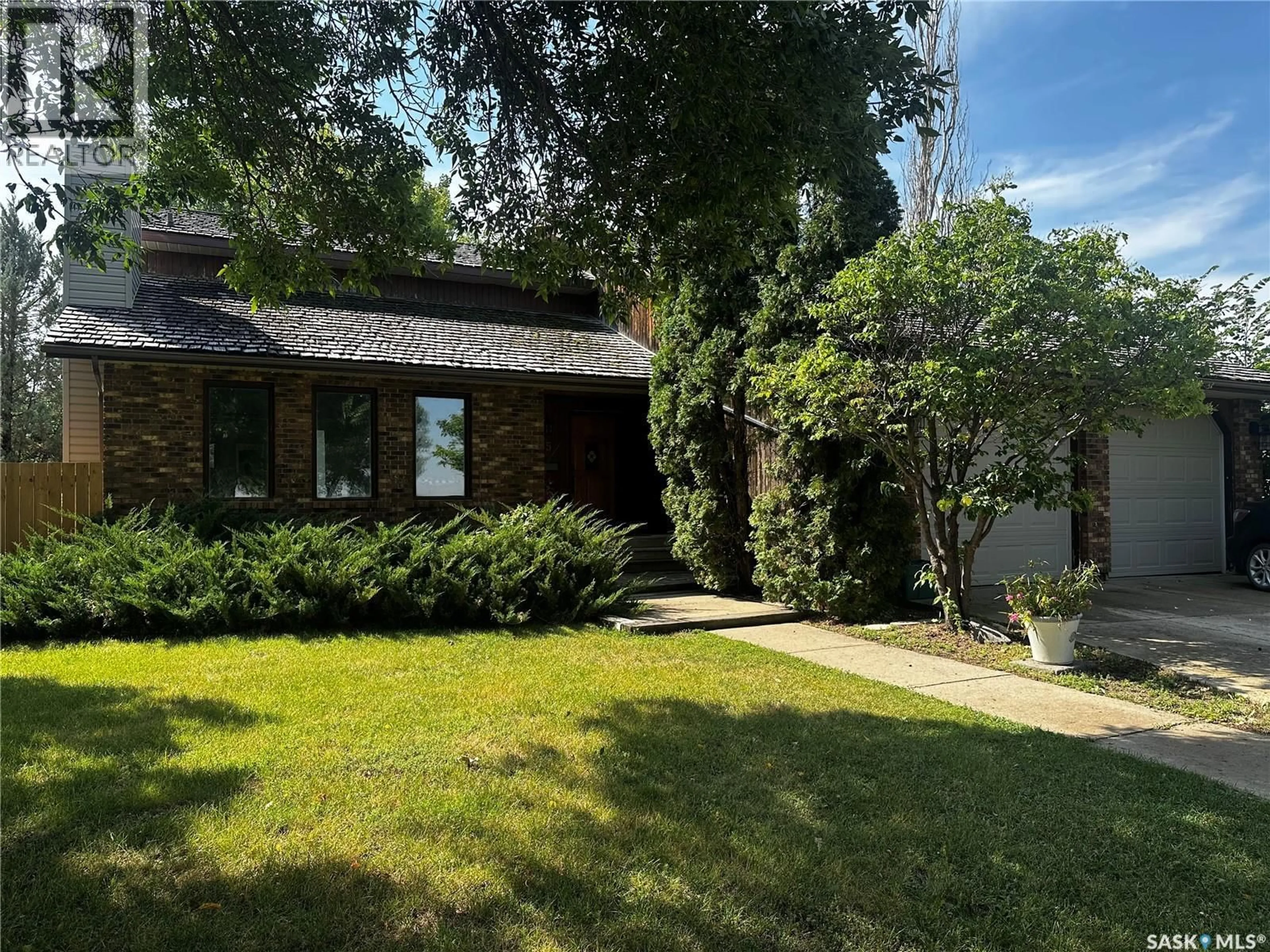 Home with brick exterior material, street for 895 BRIMACOMBE DRIVE, Weyburn Saskatchewan S4H3J6