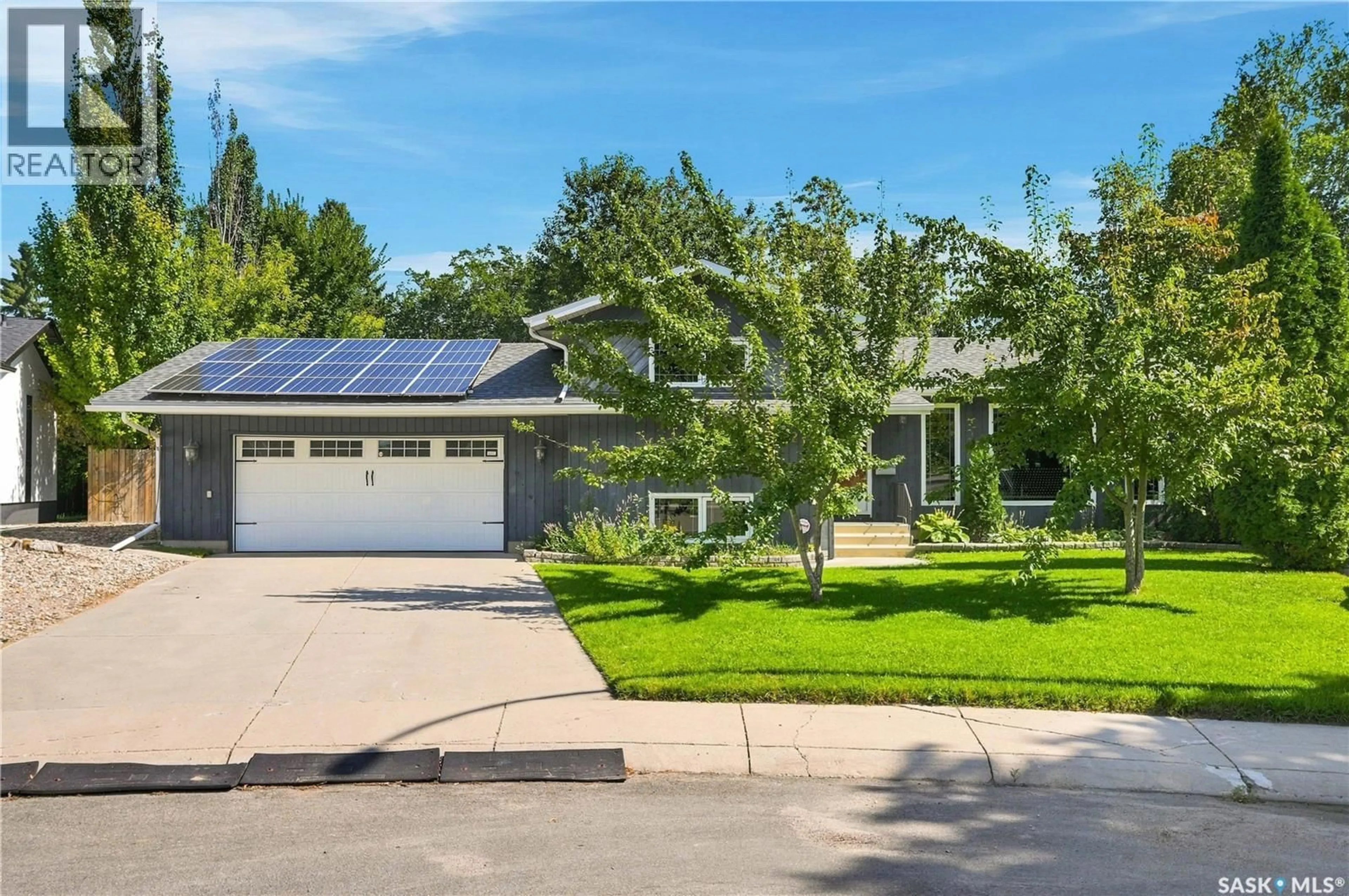 Home with vinyl exterior material, street for 210 FROBISHER CRESCENT, Saskatoon Saskatchewan S7K4Y7