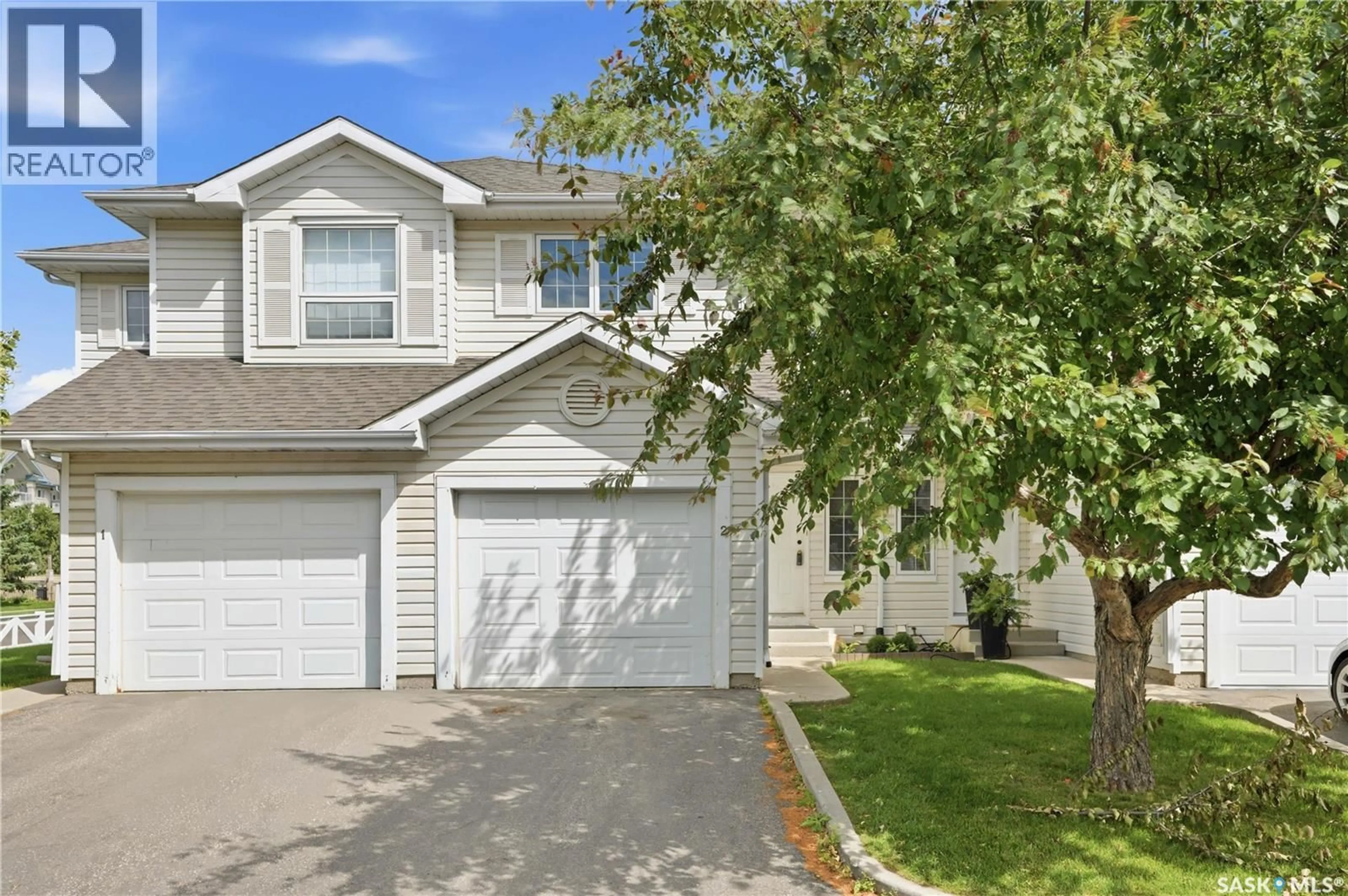 Home with vinyl exterior material, street for 2 110 KEEVIL CRESCENT, Saskatoon Saskatchewan S7N4N8