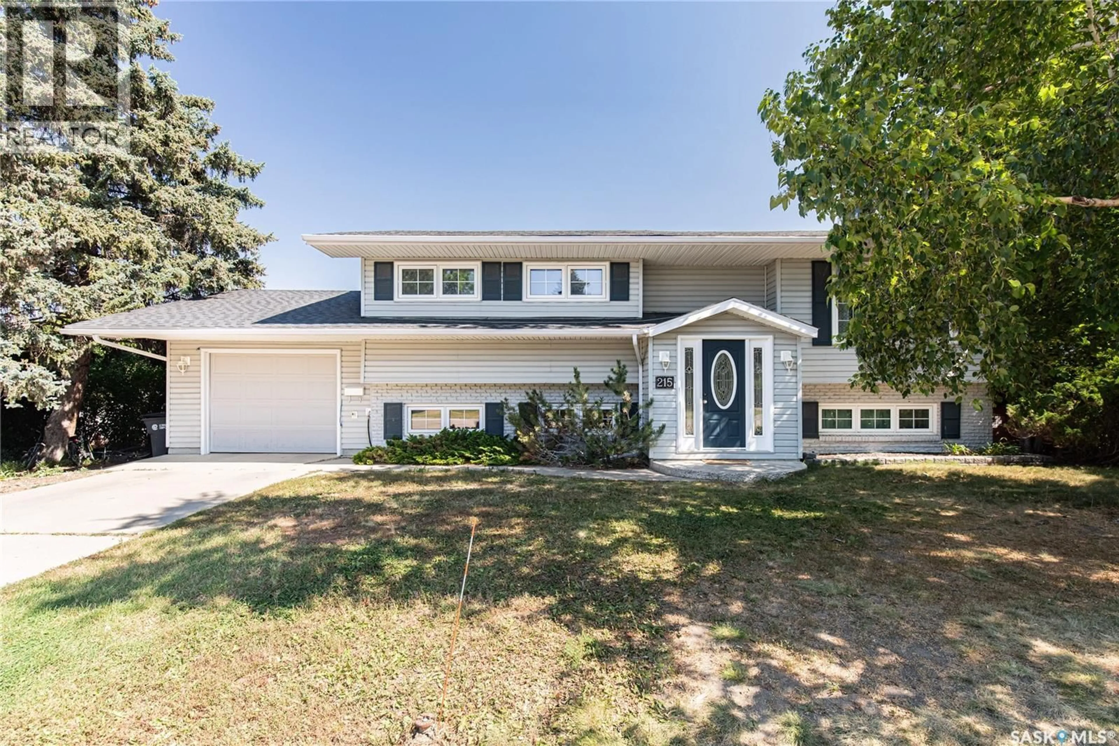 Home with vinyl exterior material, street for 215 CEDAR CRESCENT, Caronport Saskatchewan S0H0S0