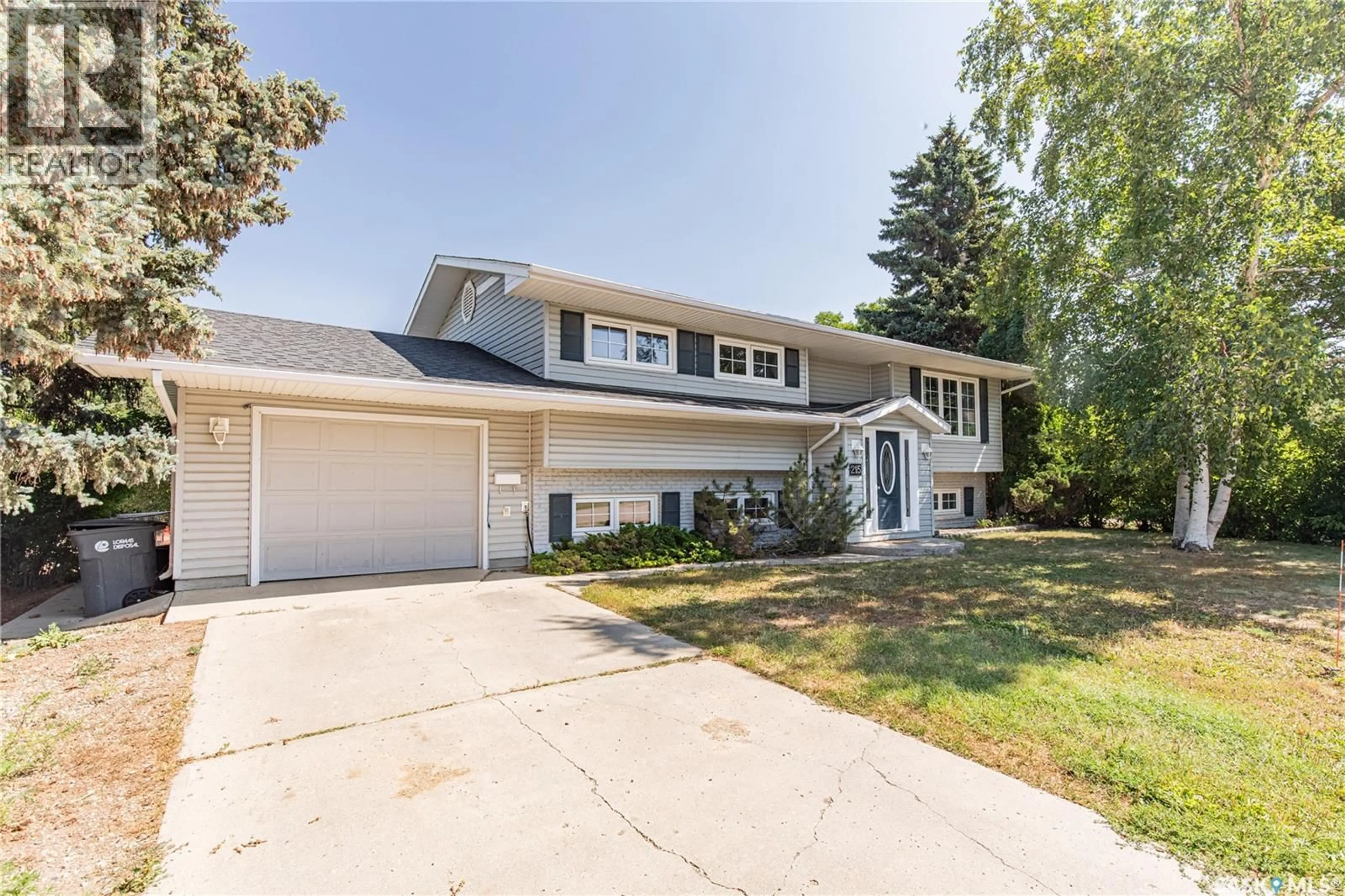 Home with vinyl exterior material, street for 215 CEDAR CRESCENT, Caronport Saskatchewan S0H0S0