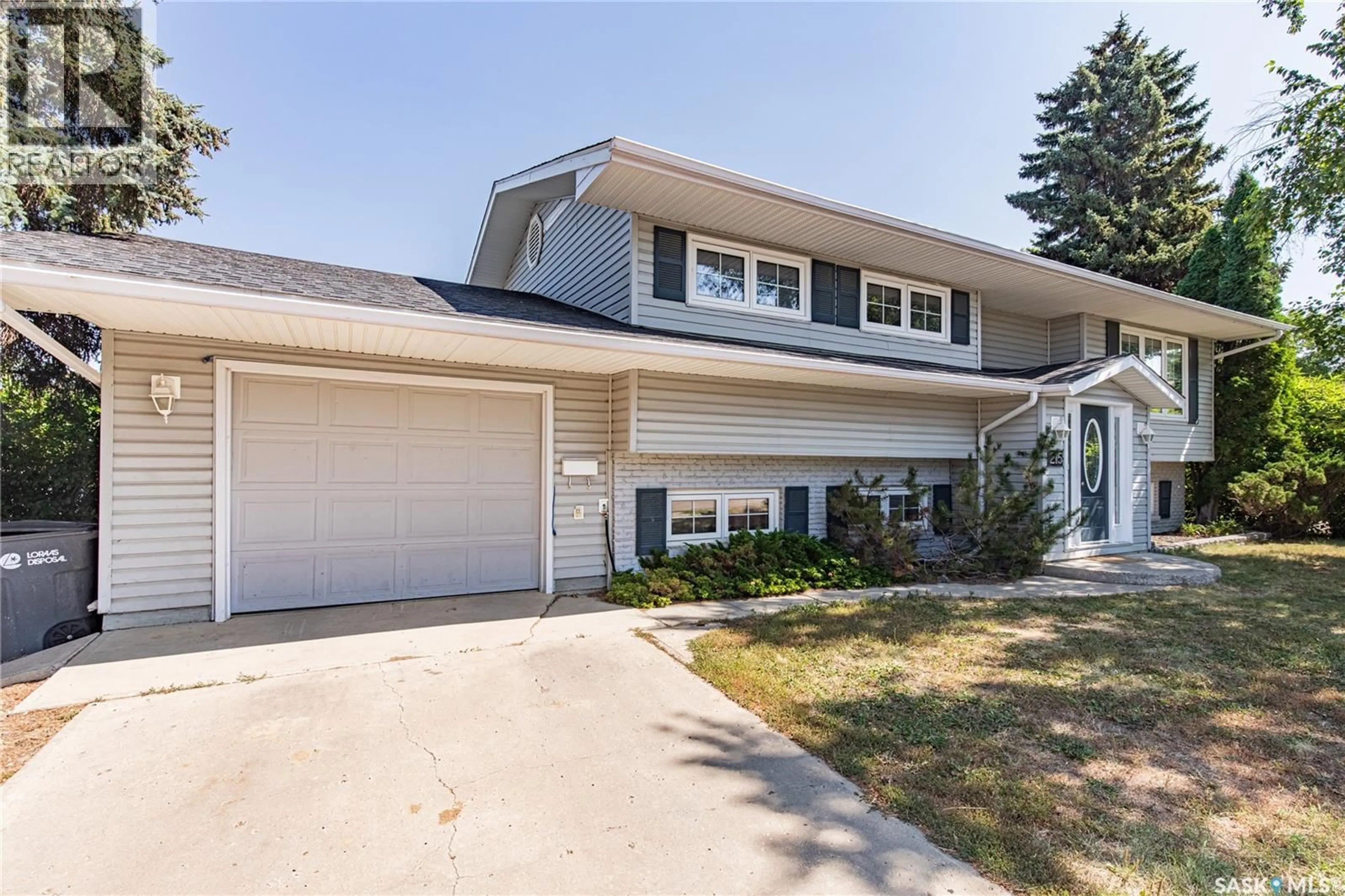 Home with vinyl exterior material, street for 215 CEDAR CRESCENT, Caronport Saskatchewan S0H0S0