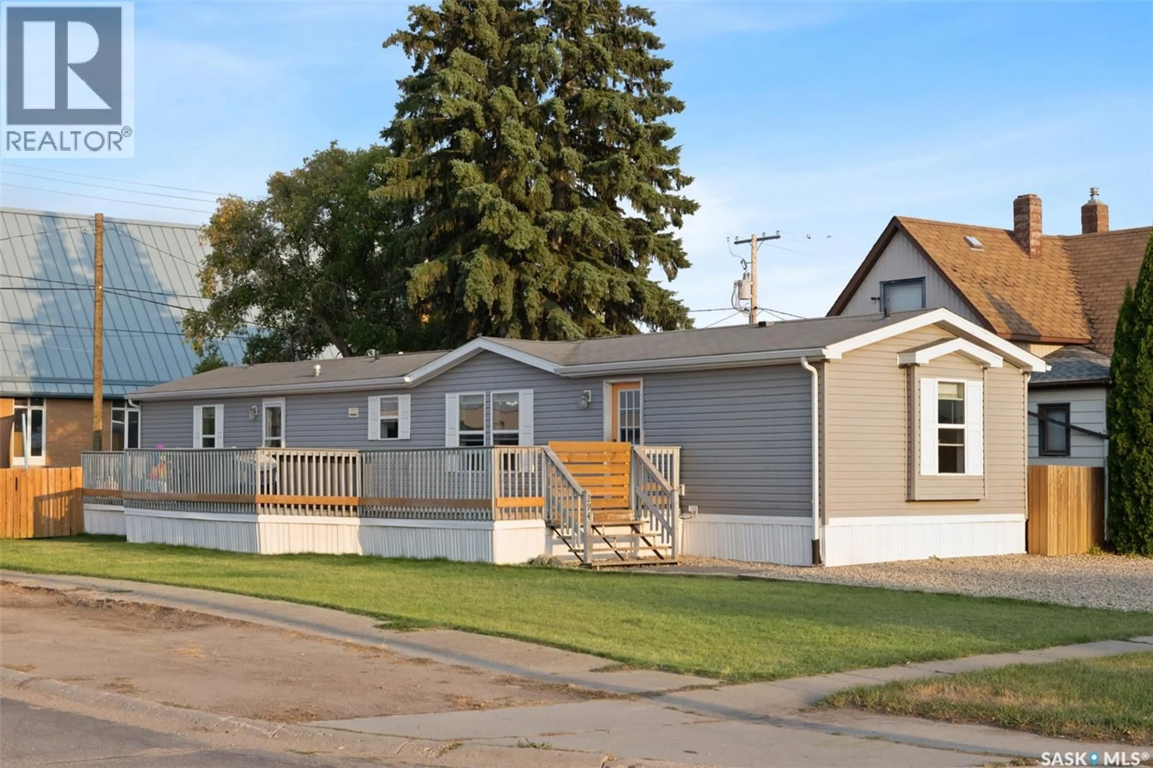 Home with vinyl exterior material, street for 294 BYRON STREET, Southey Saskatchewan S0G4P0