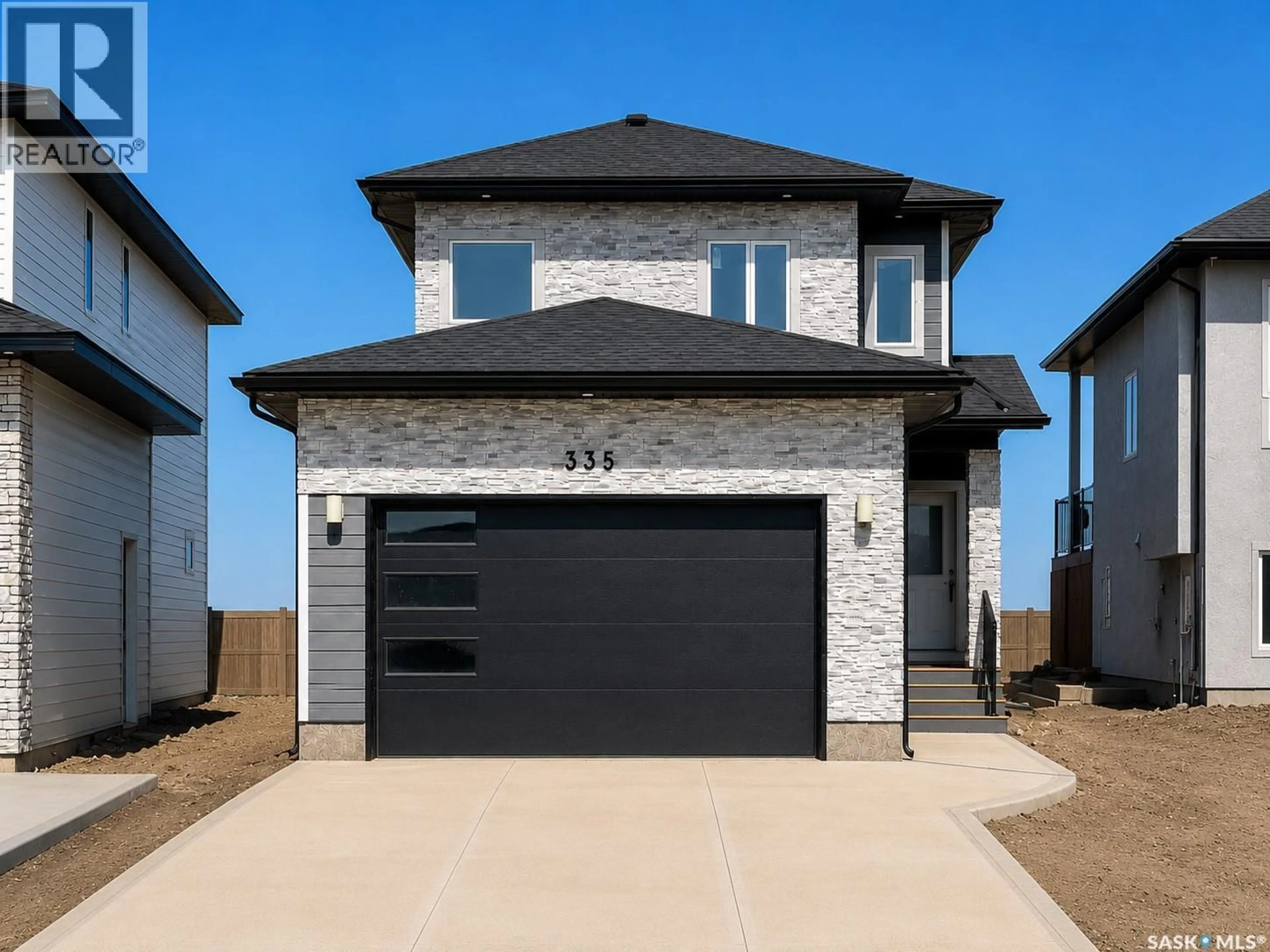 Home with brick exterior material, street for 335 SHARMA CRESCENT, Saskatoon Saskatchewan S7W1J1
