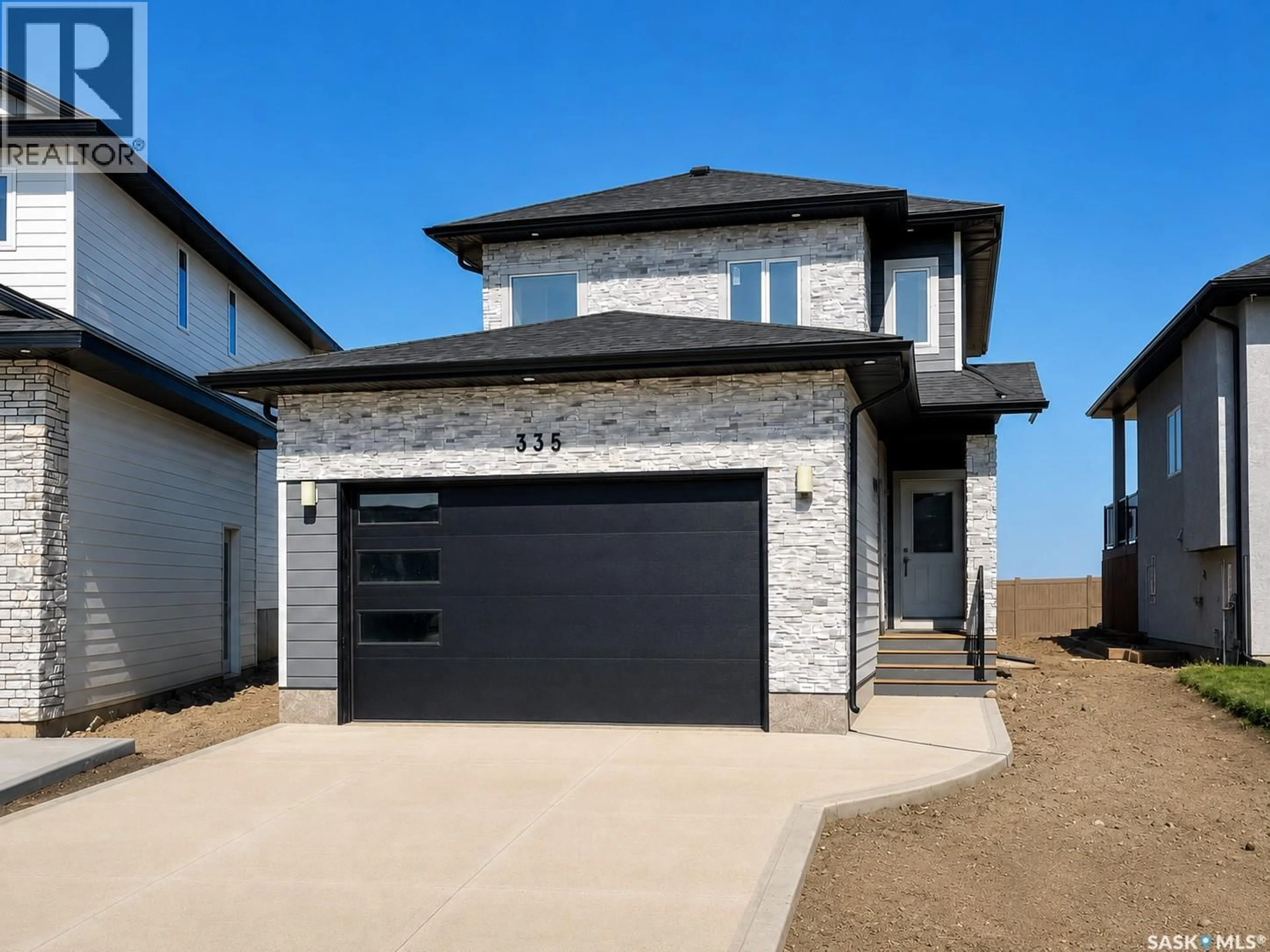 Home with brick exterior material, street for 335 SHARMA CRESCENT, Saskatoon Saskatchewan S7W1J1
