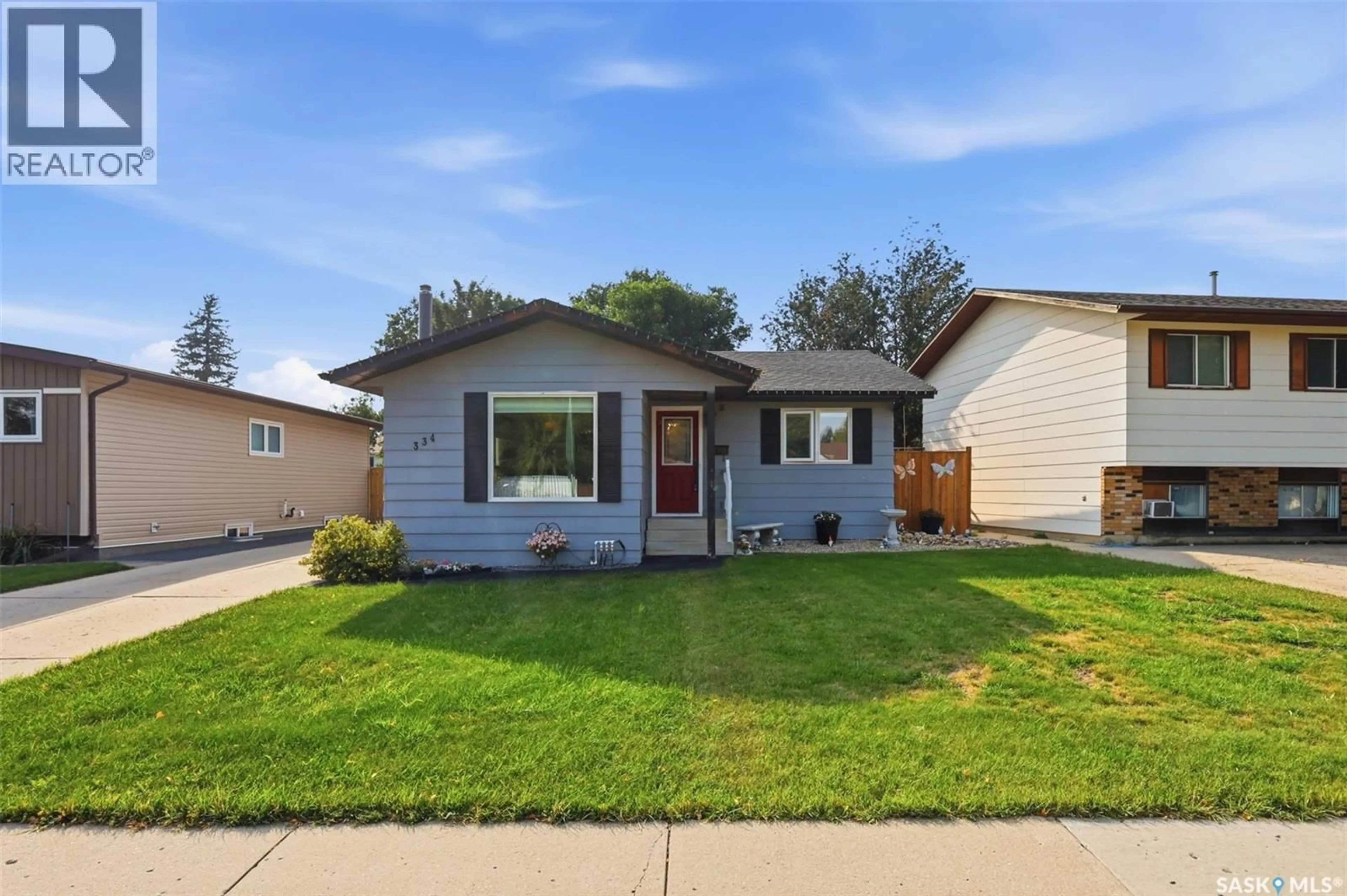 Home with vinyl exterior material, street for 334 NEEDHAM CRESCENT, Saskatoon Saskatchewan S7M4X5
