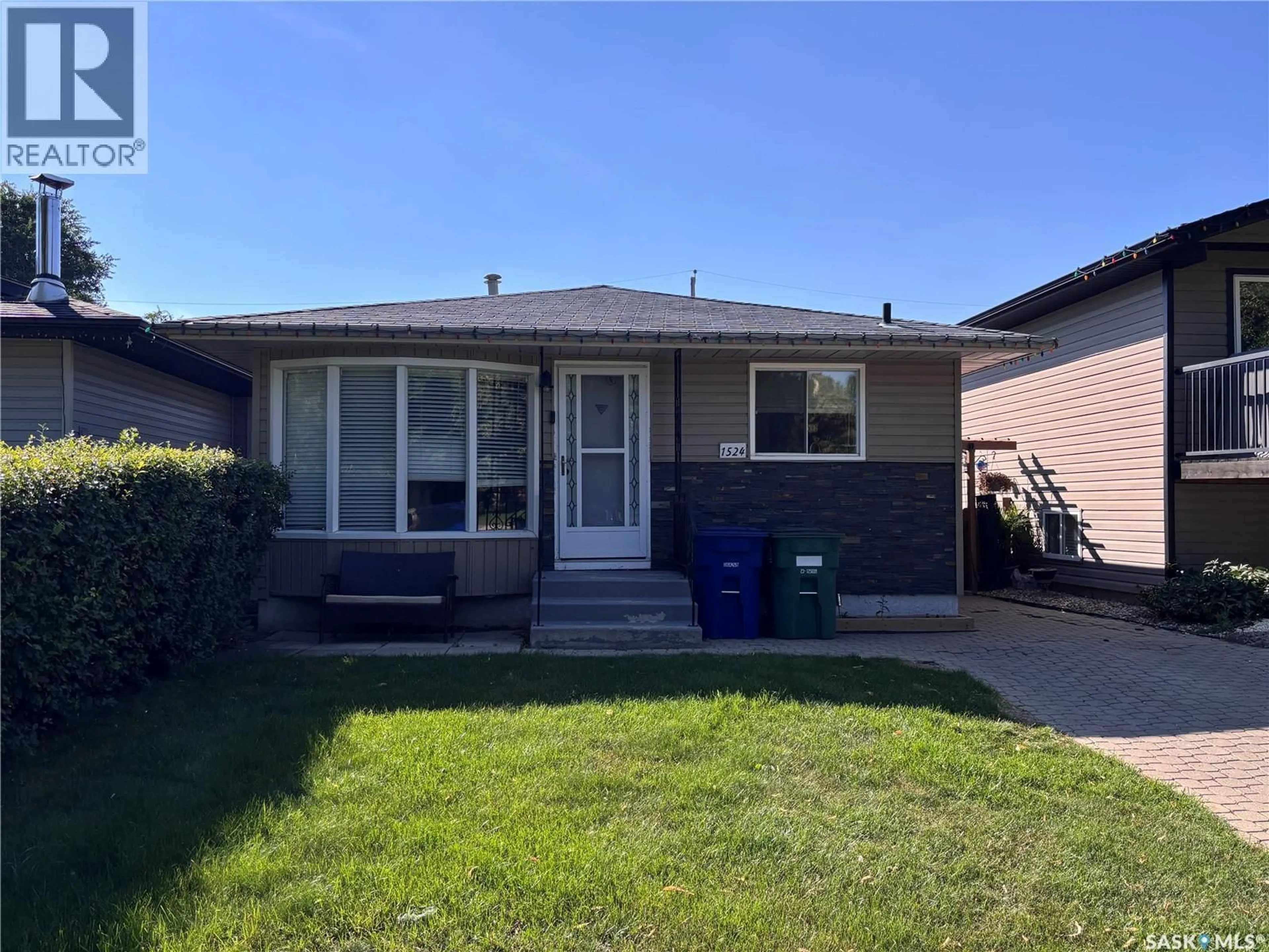 Home with vinyl exterior material, street for 1524 BRADWELL AVENUE, Saskatoon Saskatchewan S7N2R7