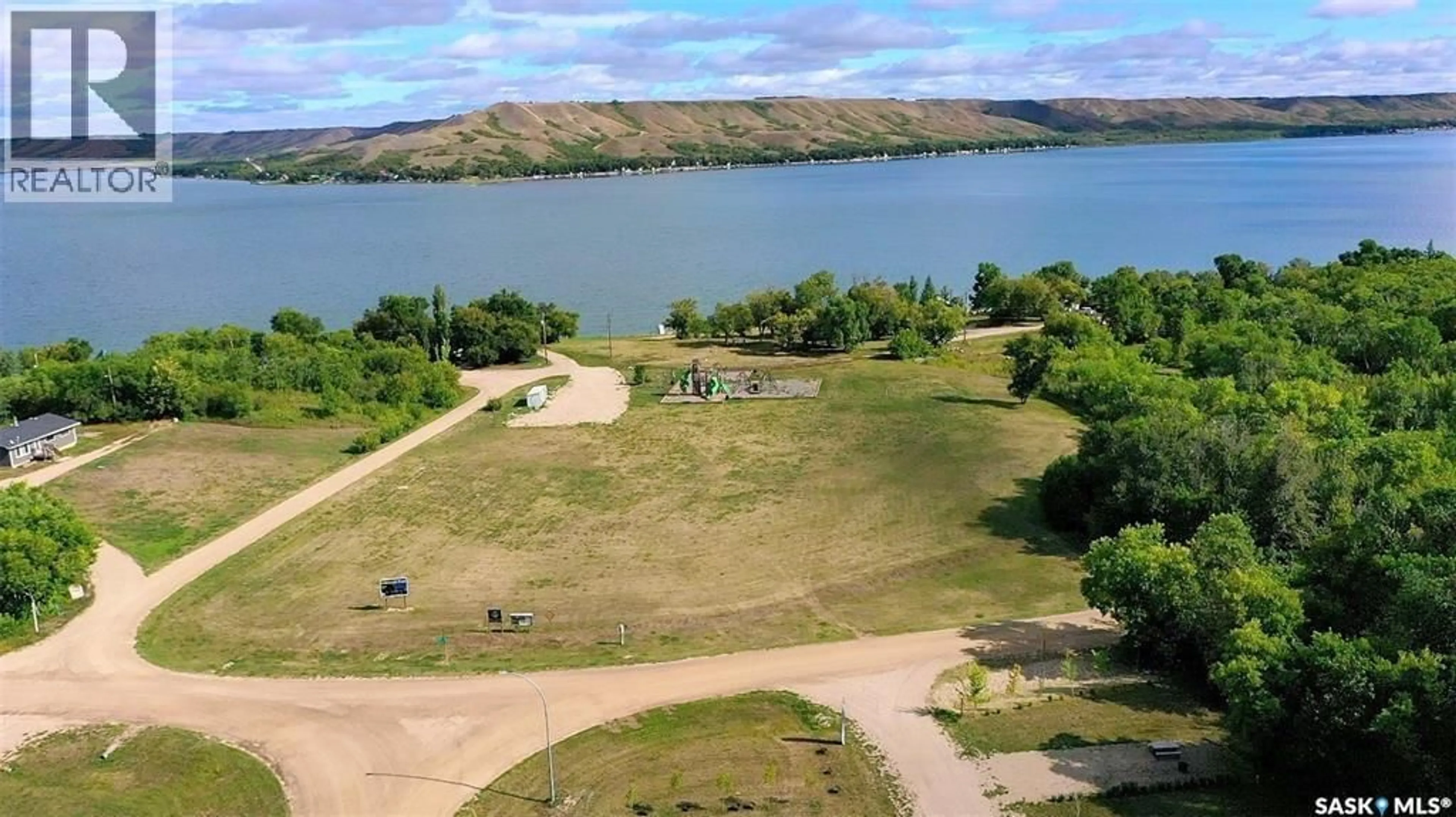 A pic from outside/outdoor area/front of a property/back of a property/a pic from drone, water/lake/river/ocean view for 14 POPLAR TRAIL, Crooked Lake Saskatchewan S0G2B0
