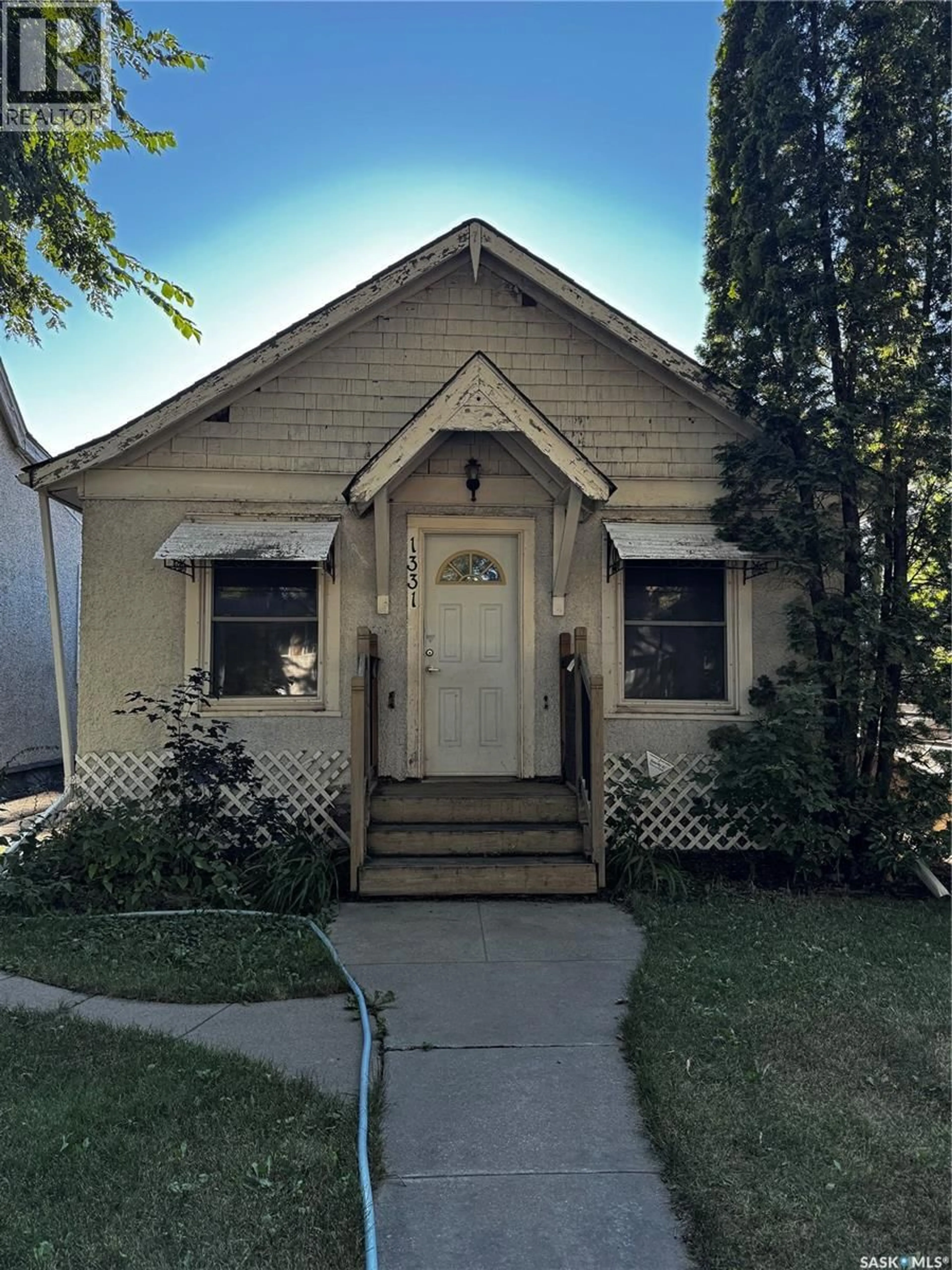 Home with vinyl exterior material, street for 1331 B AVENUE, Saskatoon Saskatchewan S7L1G6
