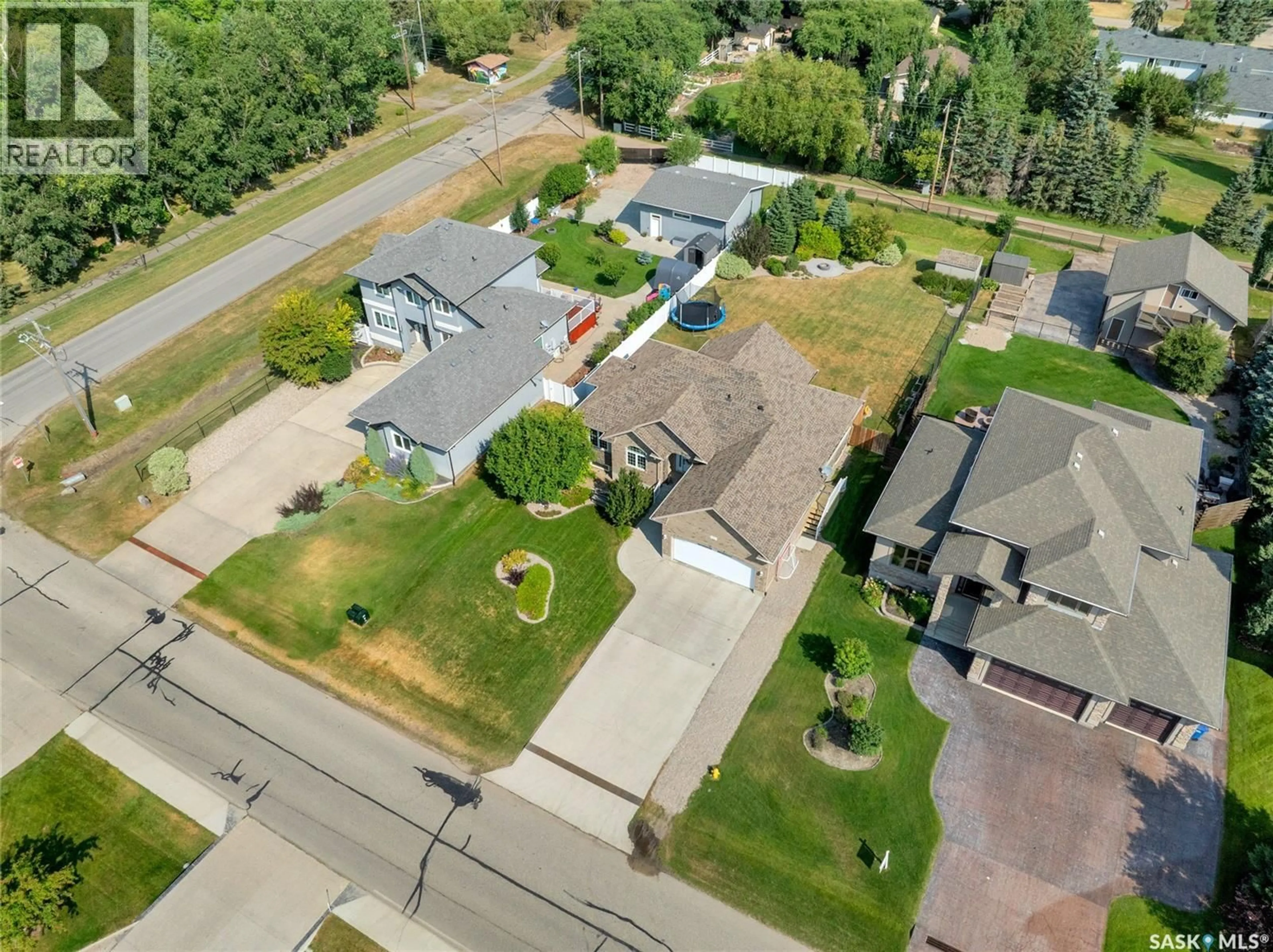 A pic from outside/outdoor area/front of a property/back of a property/a pic from drone, street for 3 LOTT ROAD, White City Saskatchewan S4L5B1
