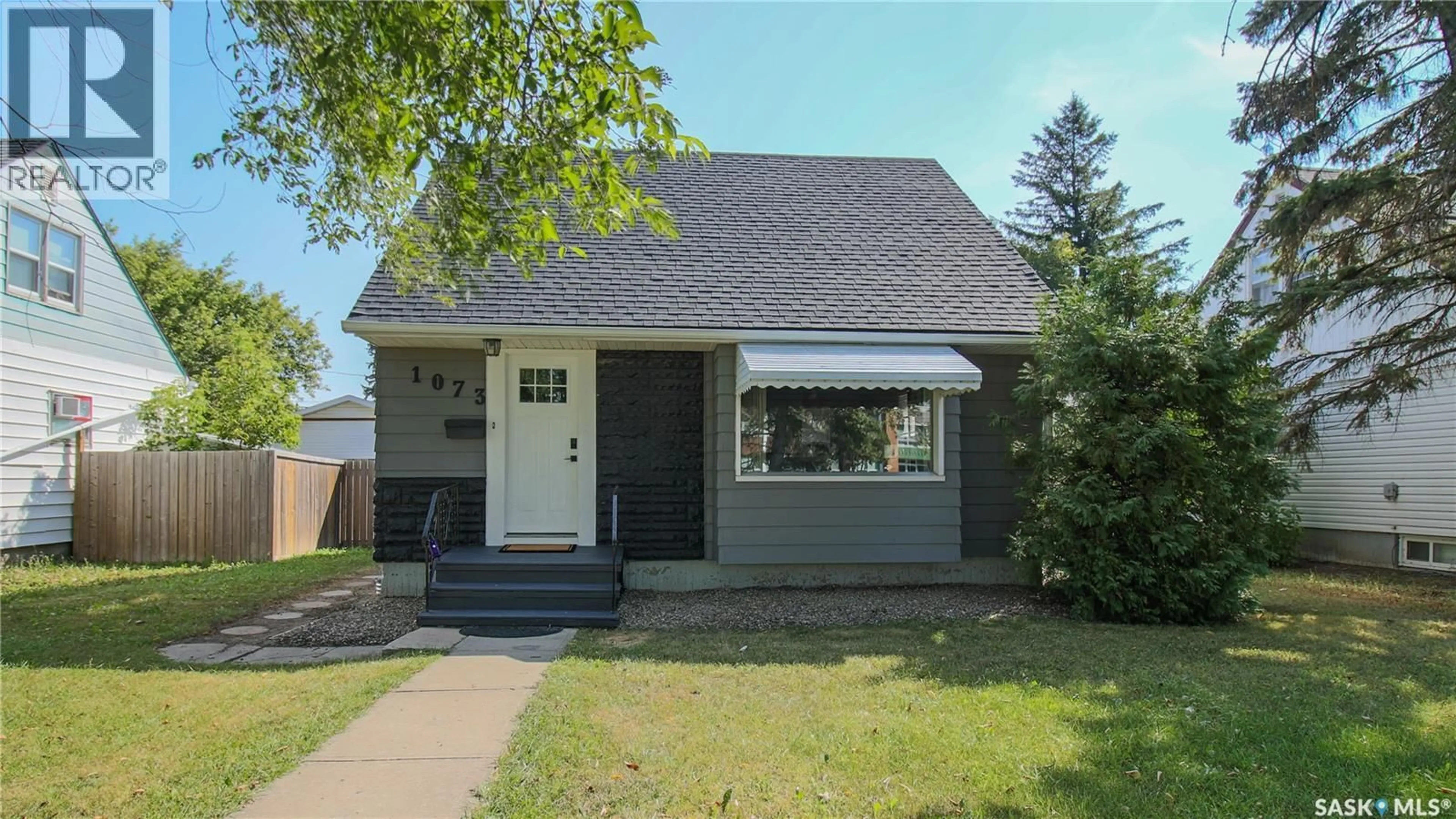Home with vinyl exterior material, street for 1073 MCINTOSH STREET, Regina Saskatchewan S4T5B8