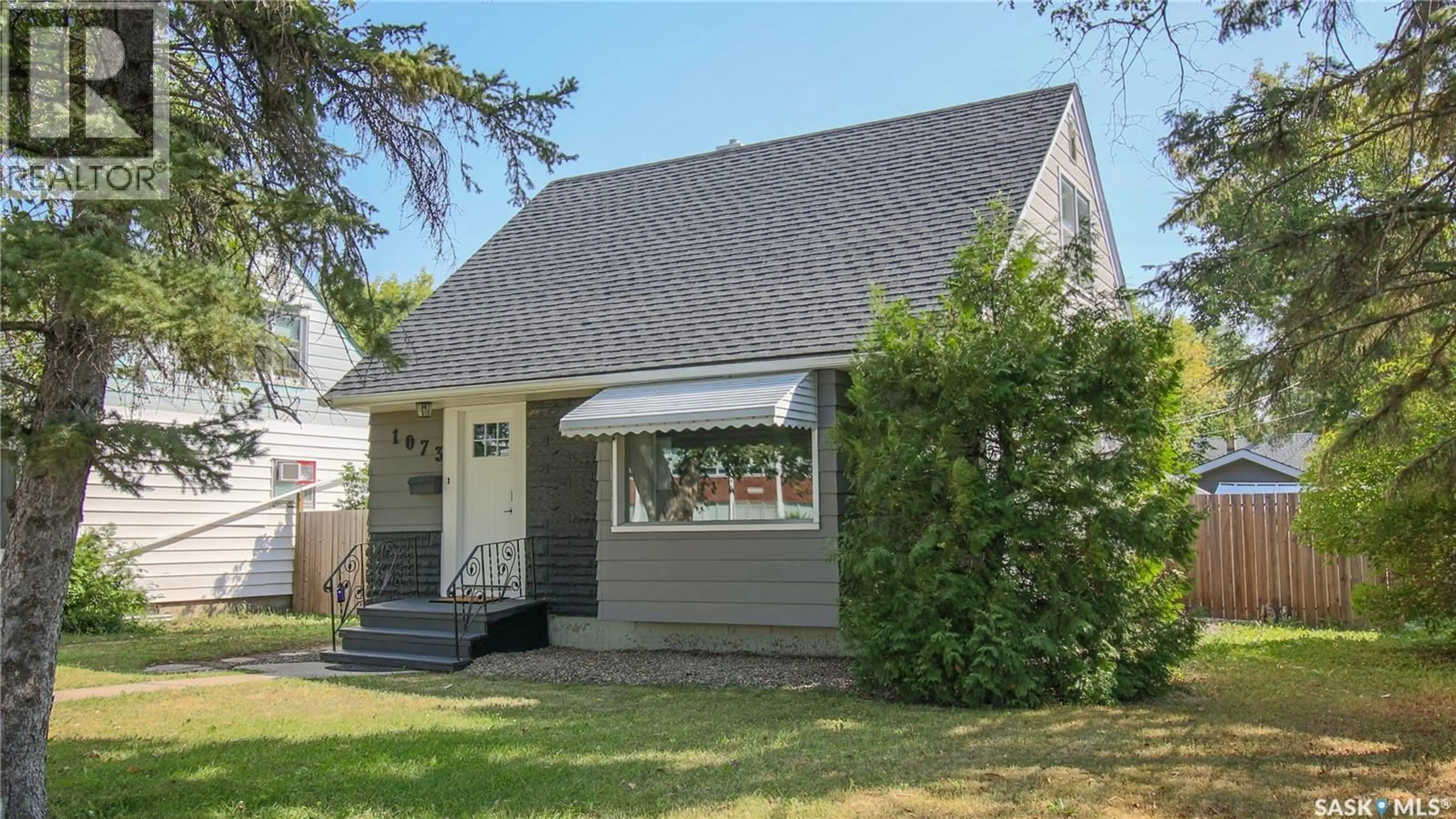 Home with vinyl exterior material, street for 1073 MCINTOSH STREET, Regina Saskatchewan S4T5B8