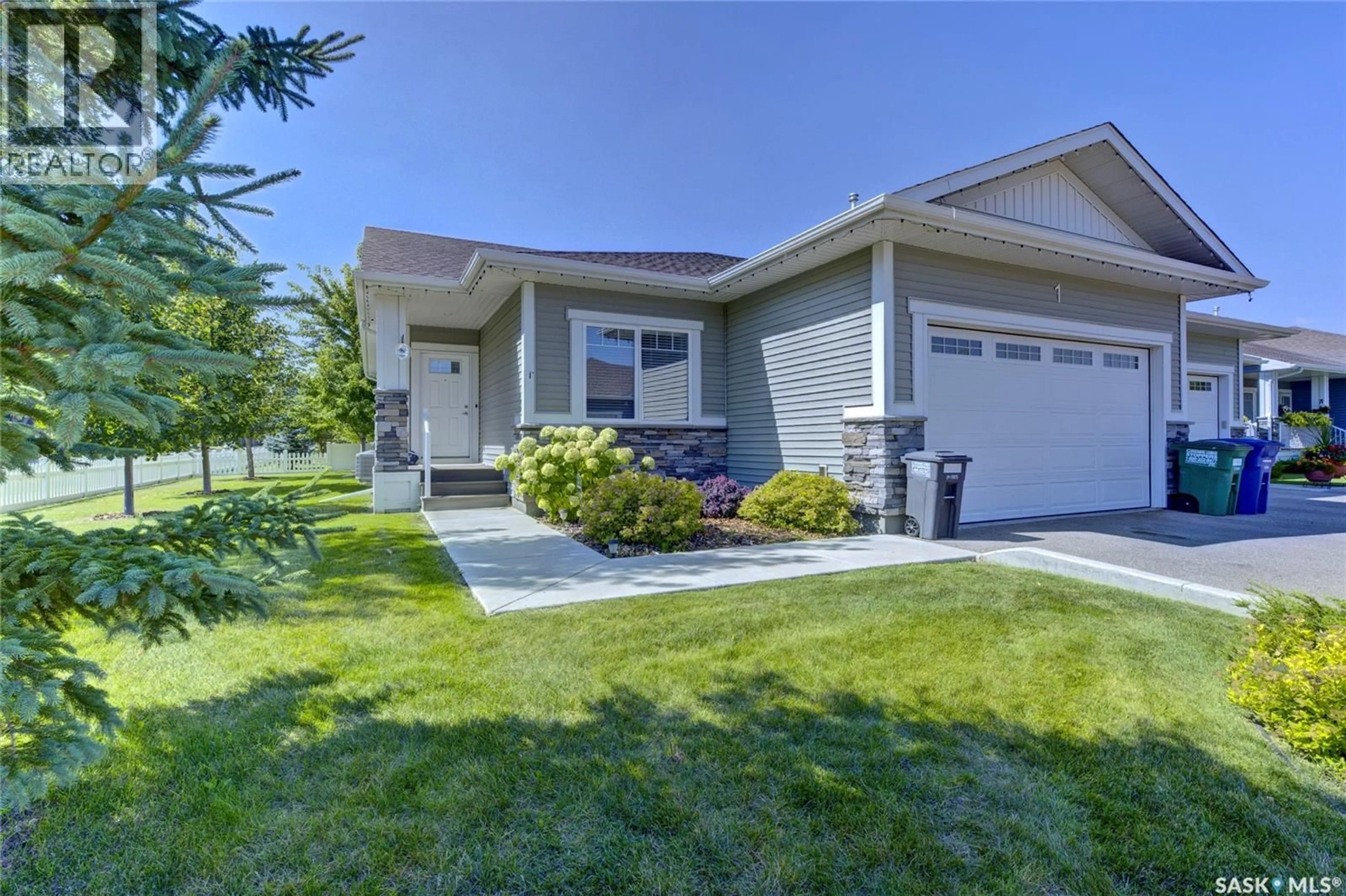 Home with vinyl exterior material, street for 3206 11TH STREET, Saskatoon Saskatchewan S7M5Z1