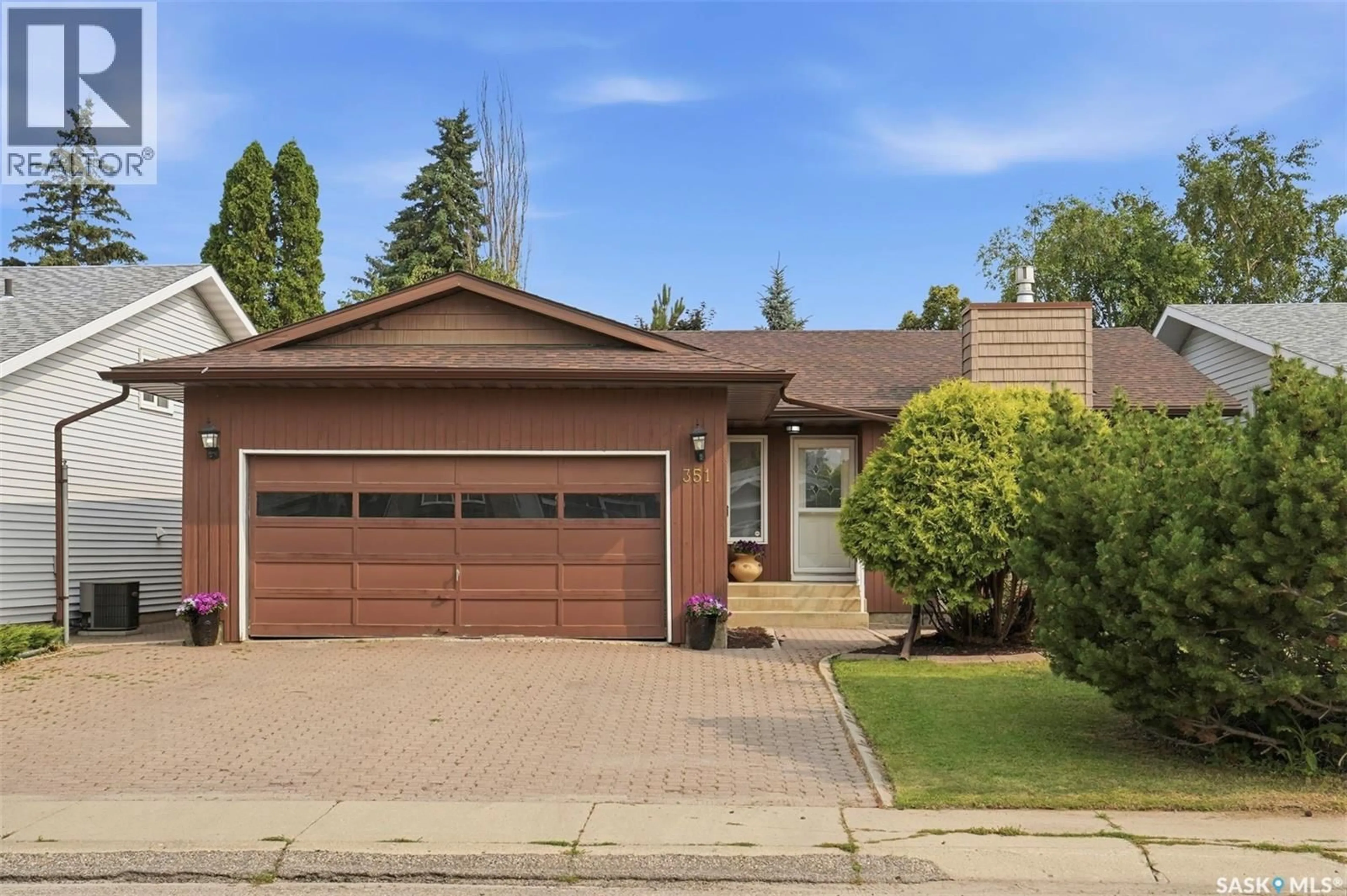 Home with vinyl exterior material, street for 351 MARCOTTE CRESCENT, Saskatoon Saskatchewan S7K7N9