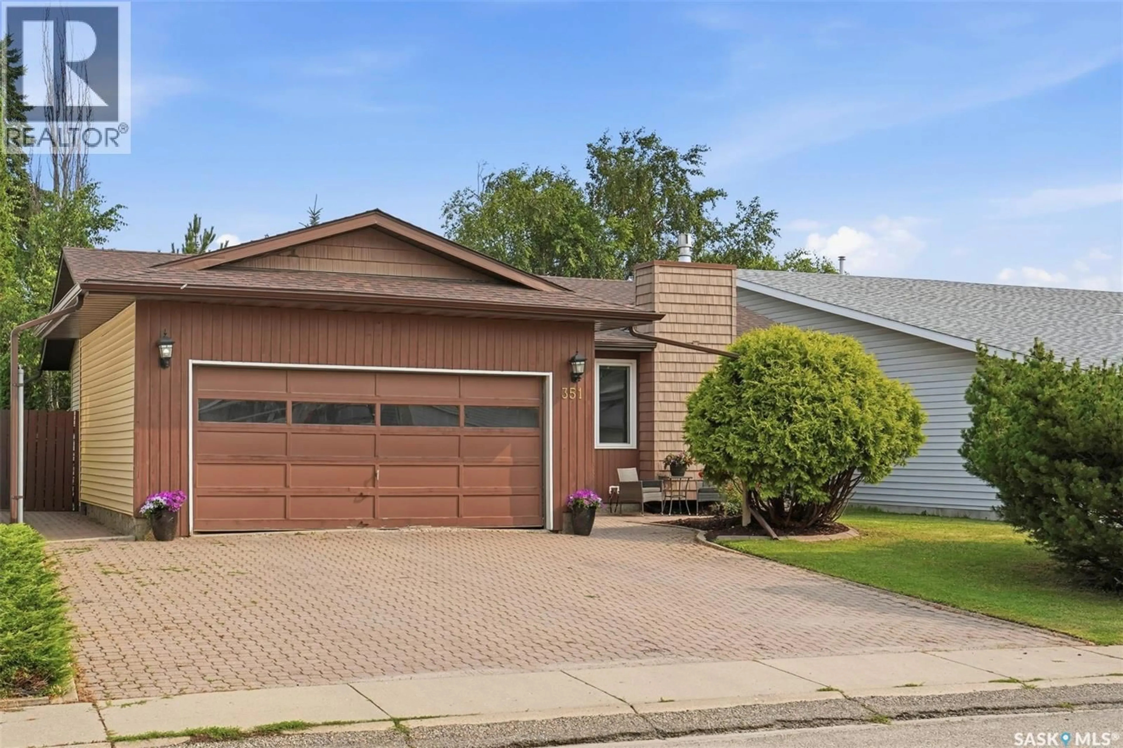 Home with vinyl exterior material, street for 351 MARCOTTE CRESCENT, Saskatoon Saskatchewan S7K7N9
