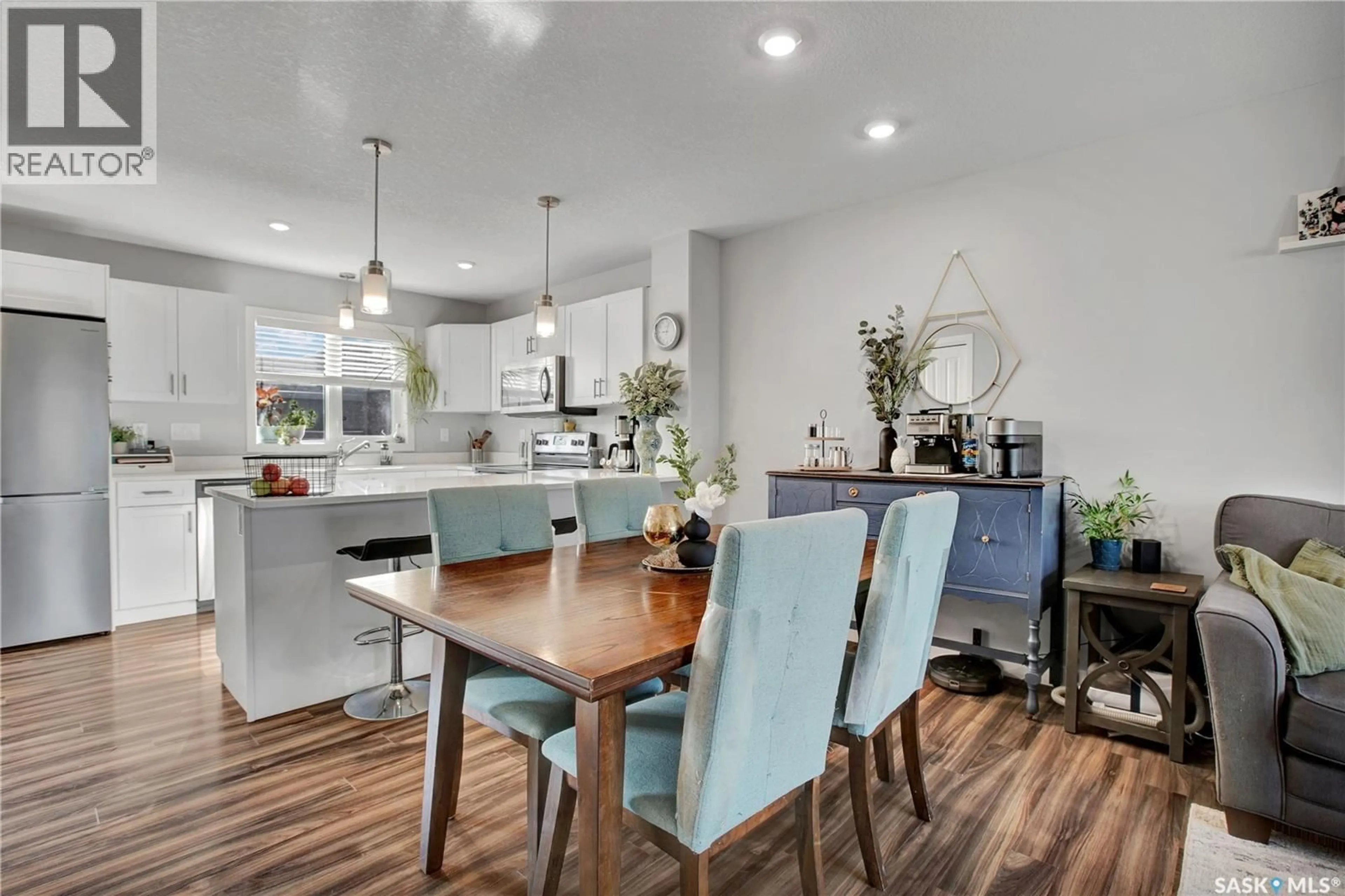 Open concept kitchen, wood/laminate floor for 149 CODETTE LANE, Martensville Saskatchewan S0K2T1