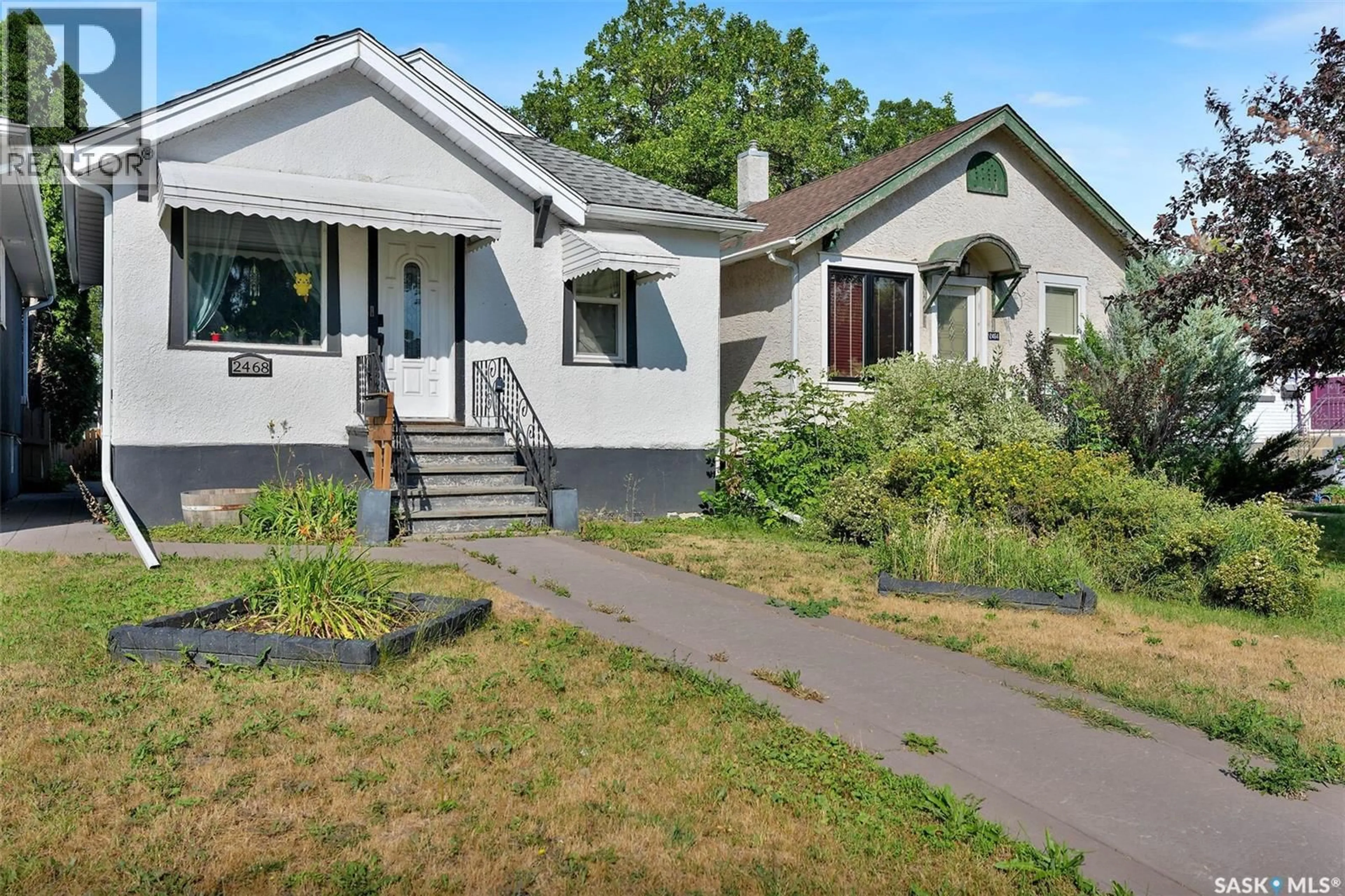 Home with vinyl exterior material, street for 2468 ELLIOTT STREET, Regina Saskatchewan S4N3H3