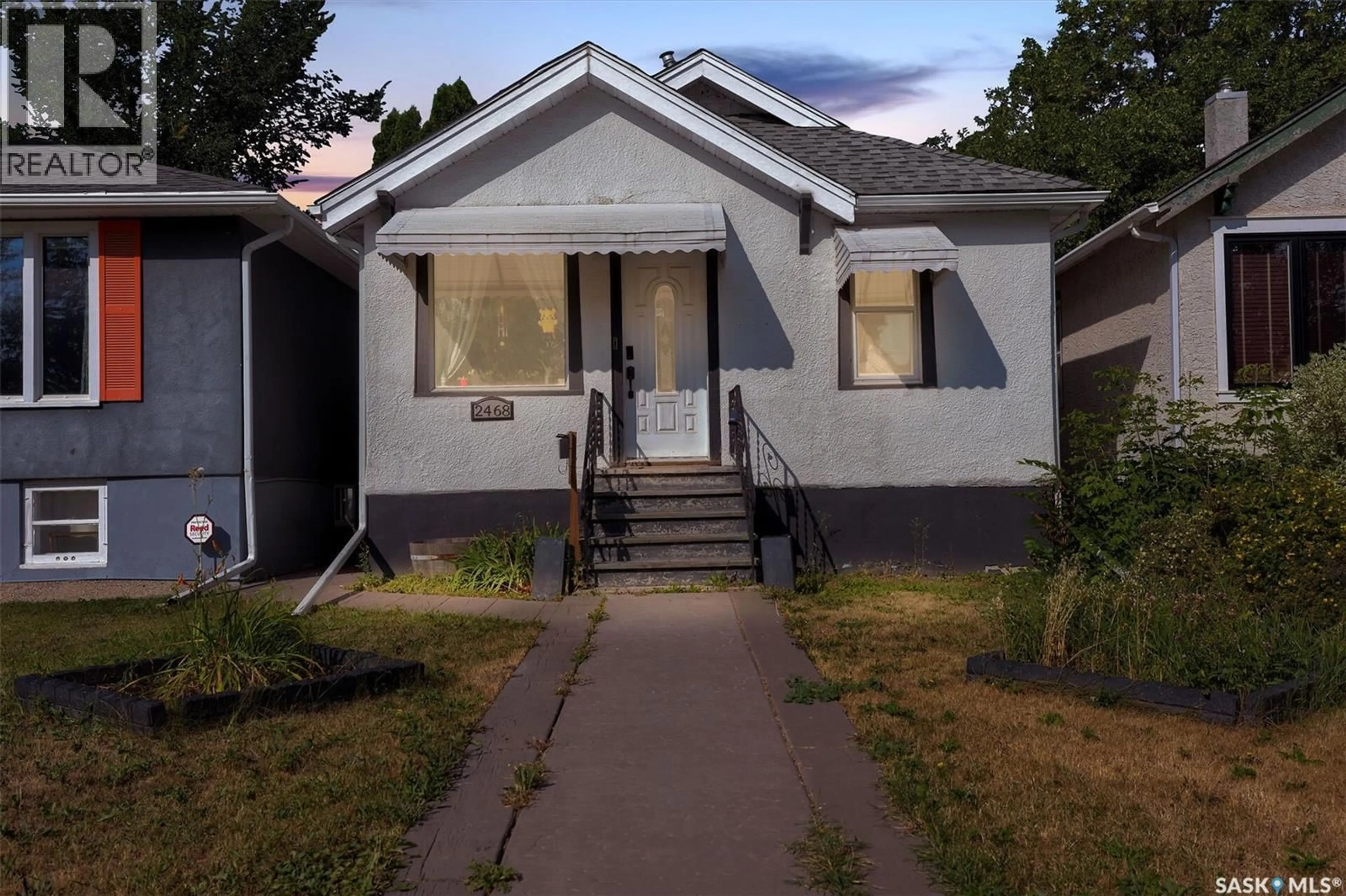 Home with vinyl exterior material, street for 2468 ELLIOTT STREET, Regina Saskatchewan S4N3H3