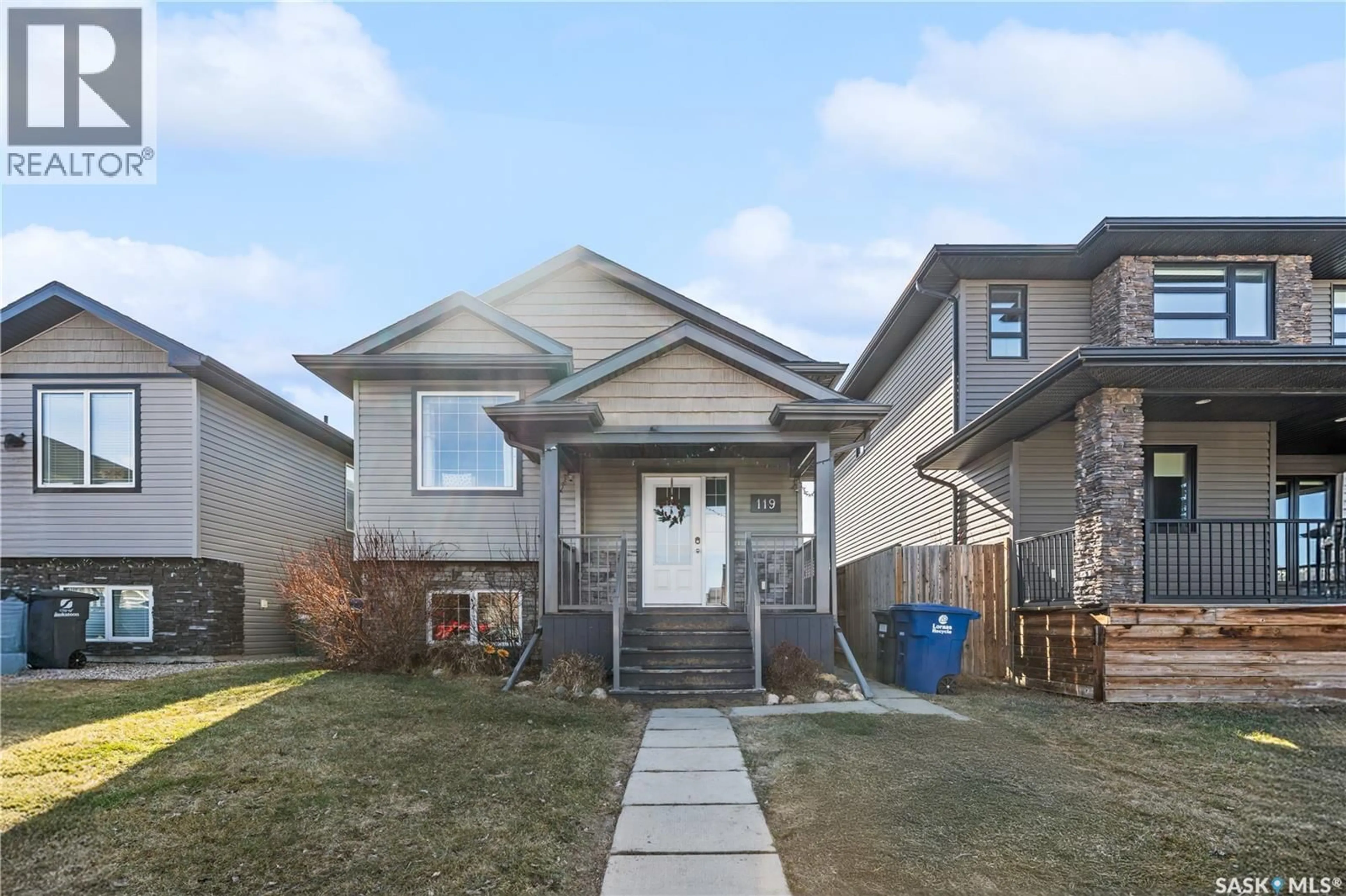 Home with vinyl exterior material, street for 119 MANINGAS BEND, Saskatoon Saskatchewan S7S1N1