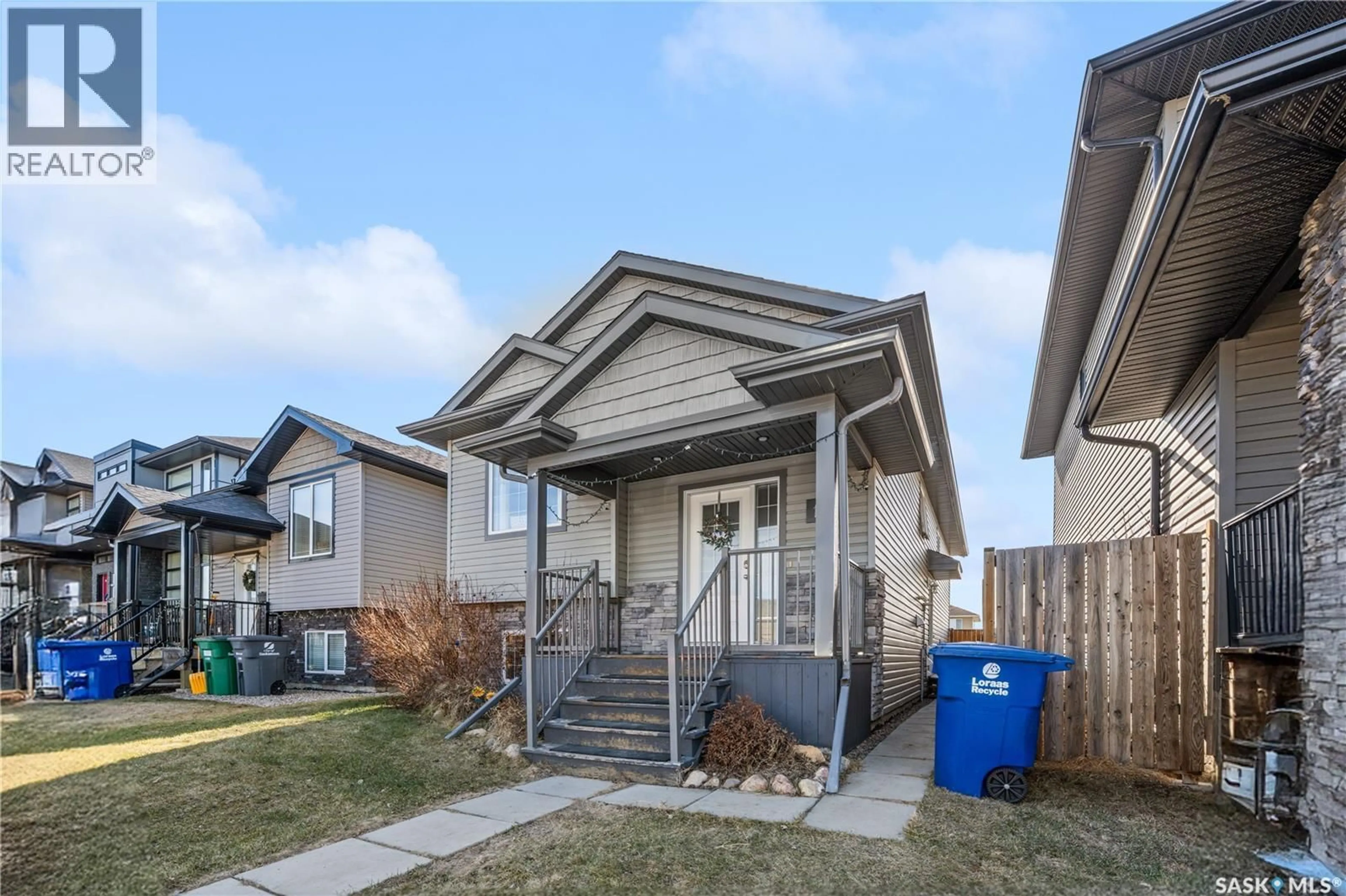Home with vinyl exterior material, street for 119 MANINGAS BEND, Saskatoon Saskatchewan S7S1N1