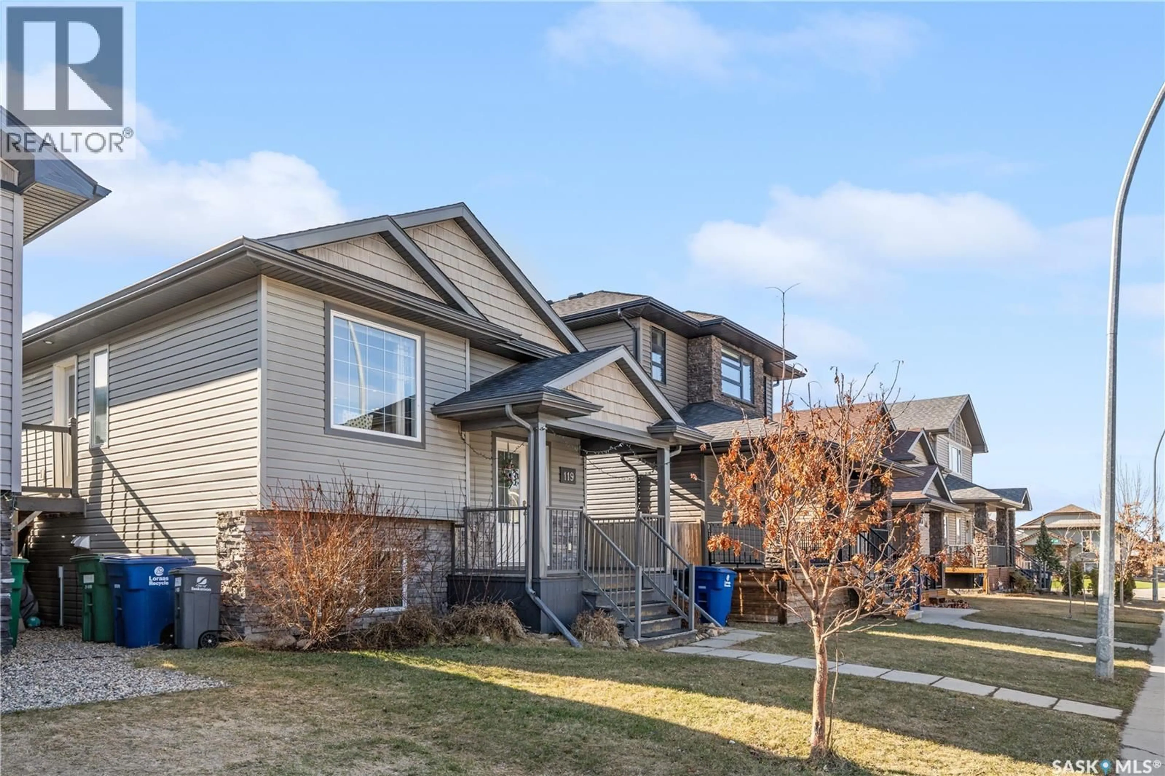 Home with vinyl exterior material, street for 119 MANINGAS BEND, Saskatoon Saskatchewan S7S1N1