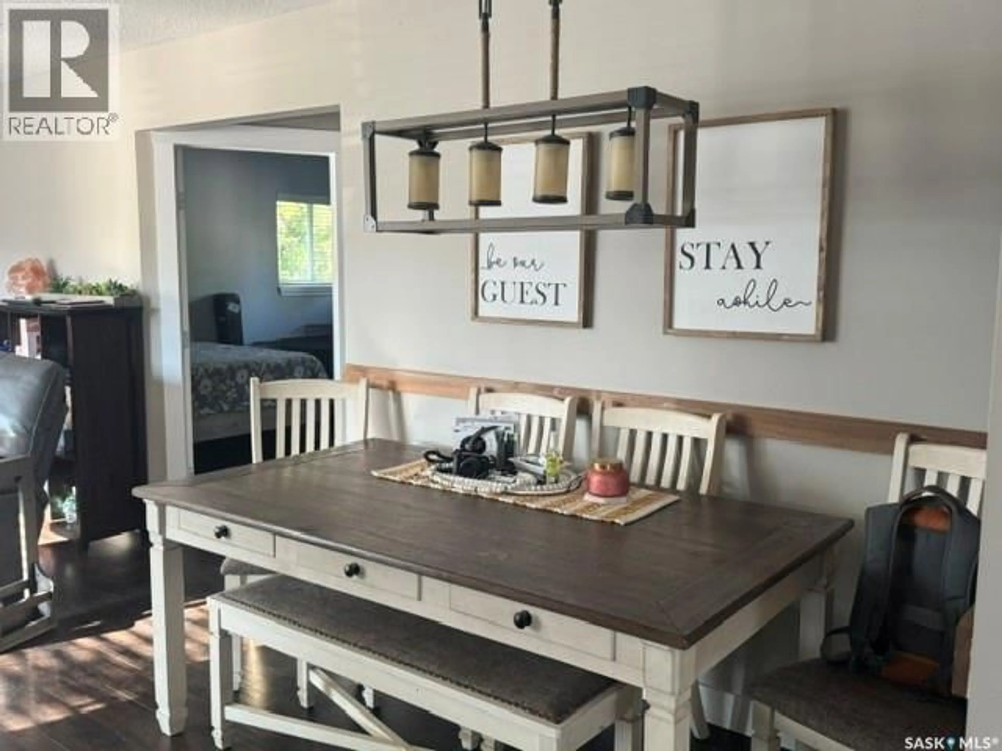 Dining room, wood/laminate floor for 1621 103RD STREET, North Battleford Saskatchewan S9A1L6