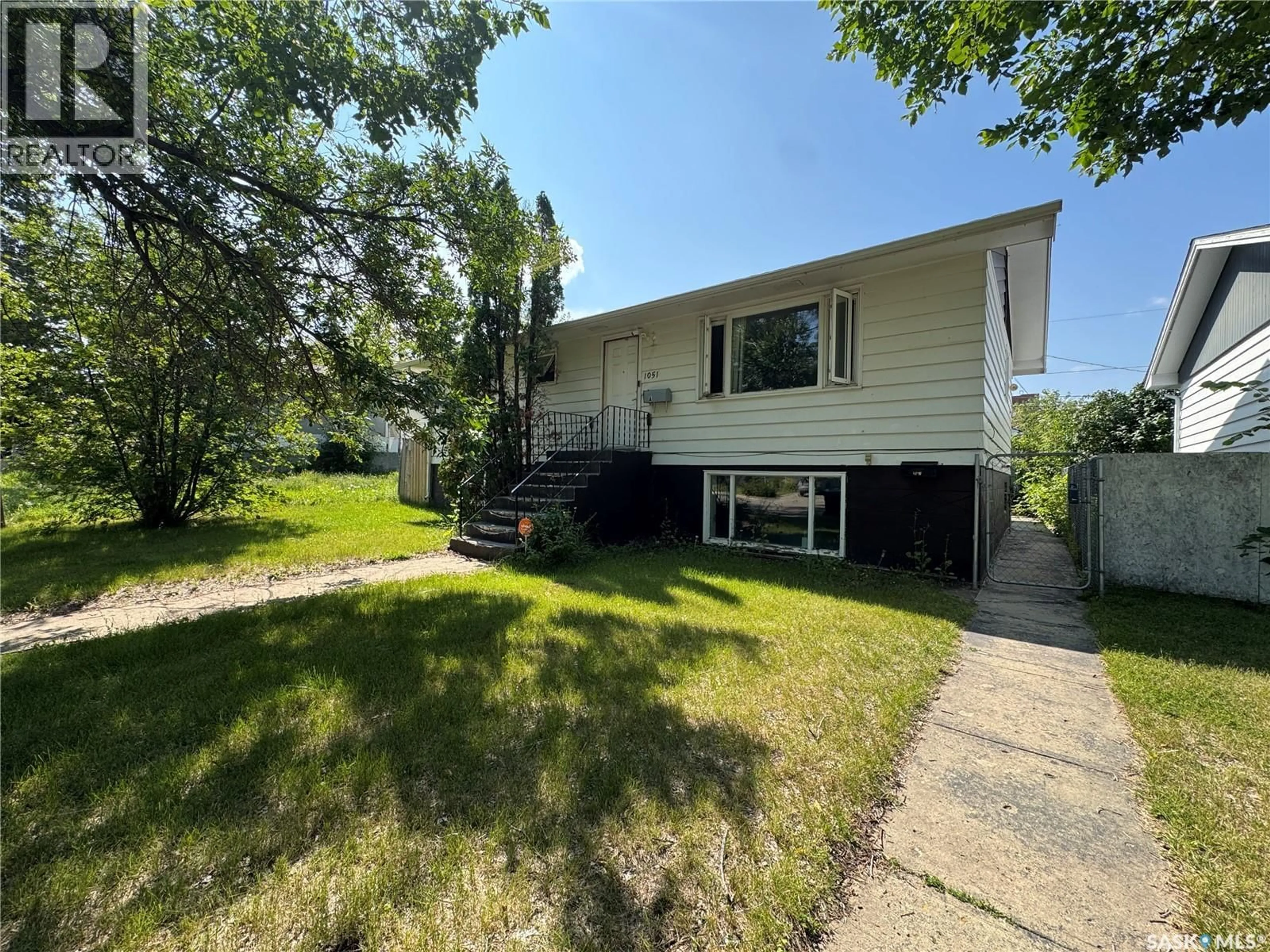 Home with vinyl exterior material, street for 1051 109TH STREET, North Battleford Saskatchewan S9A2E3