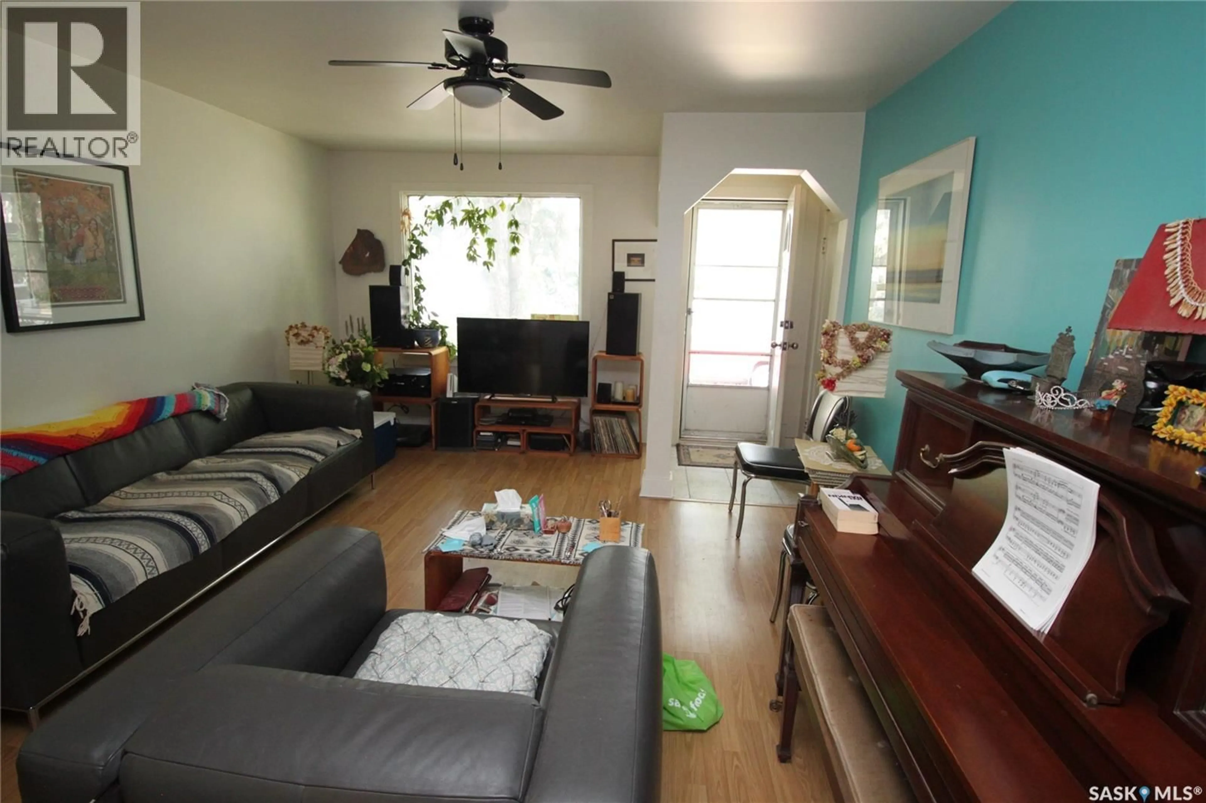 Living room with furniture, wood/laminate floor for 612 7TH STREET, Saskatoon Saskatchewan S7H0X9