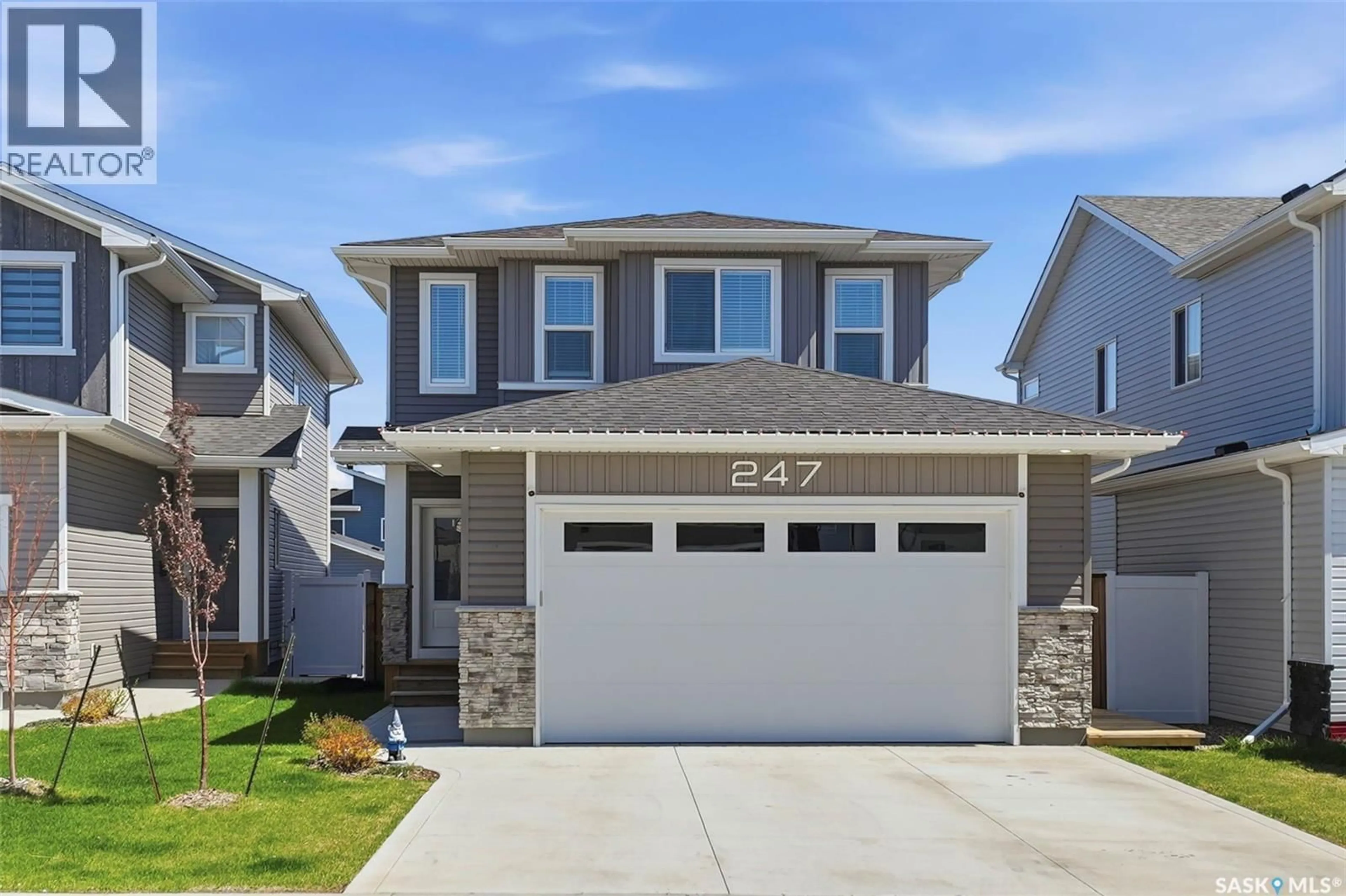 Home with vinyl exterior material, street for 247 PRASAD MANOR, Saskatoon Saskatchewan S7V1L5