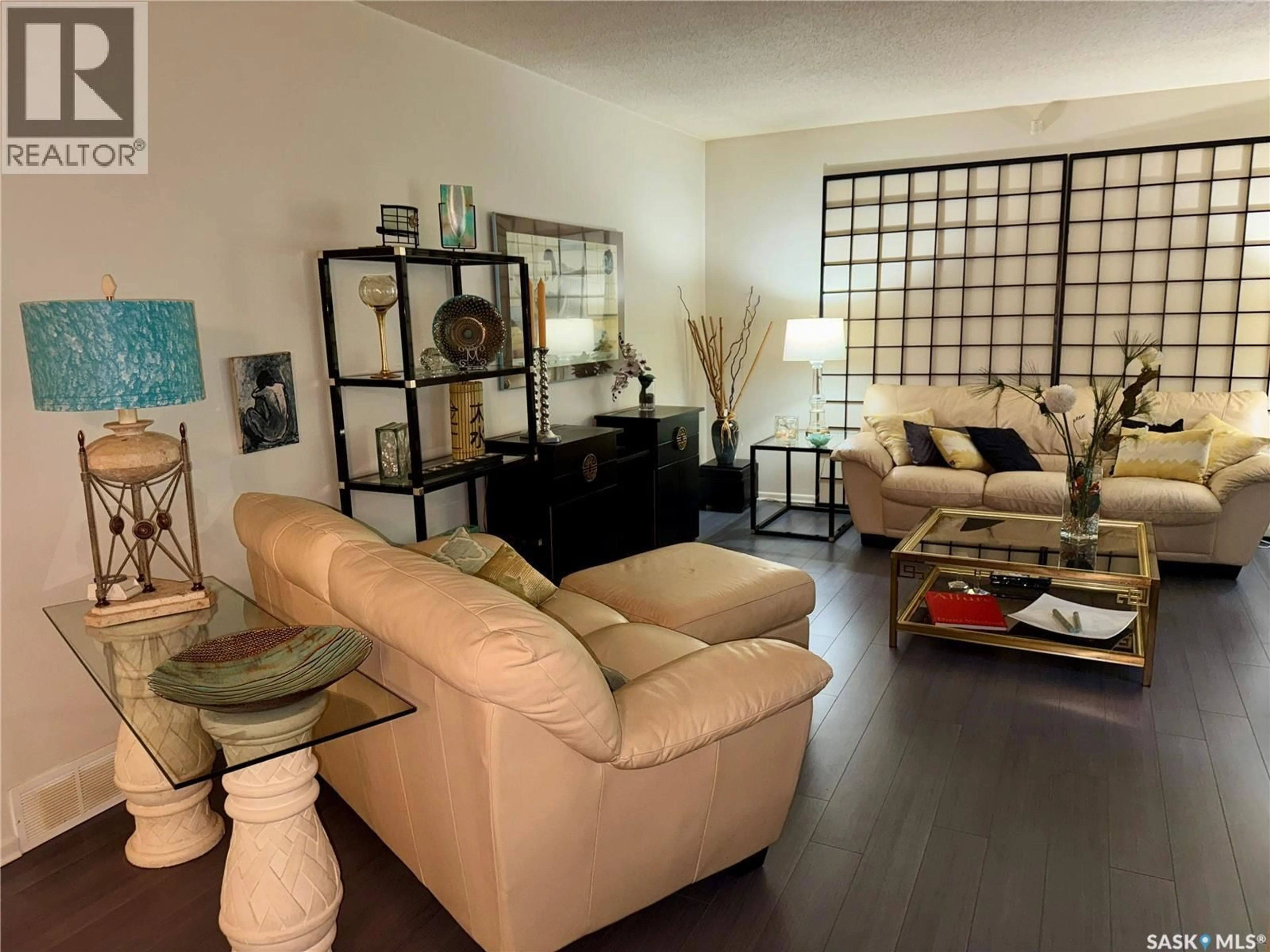 Living room with furniture, wood/laminate floor for 42 SPINKS DRIVE, Saskatoon Saskatchewan S7H4B8