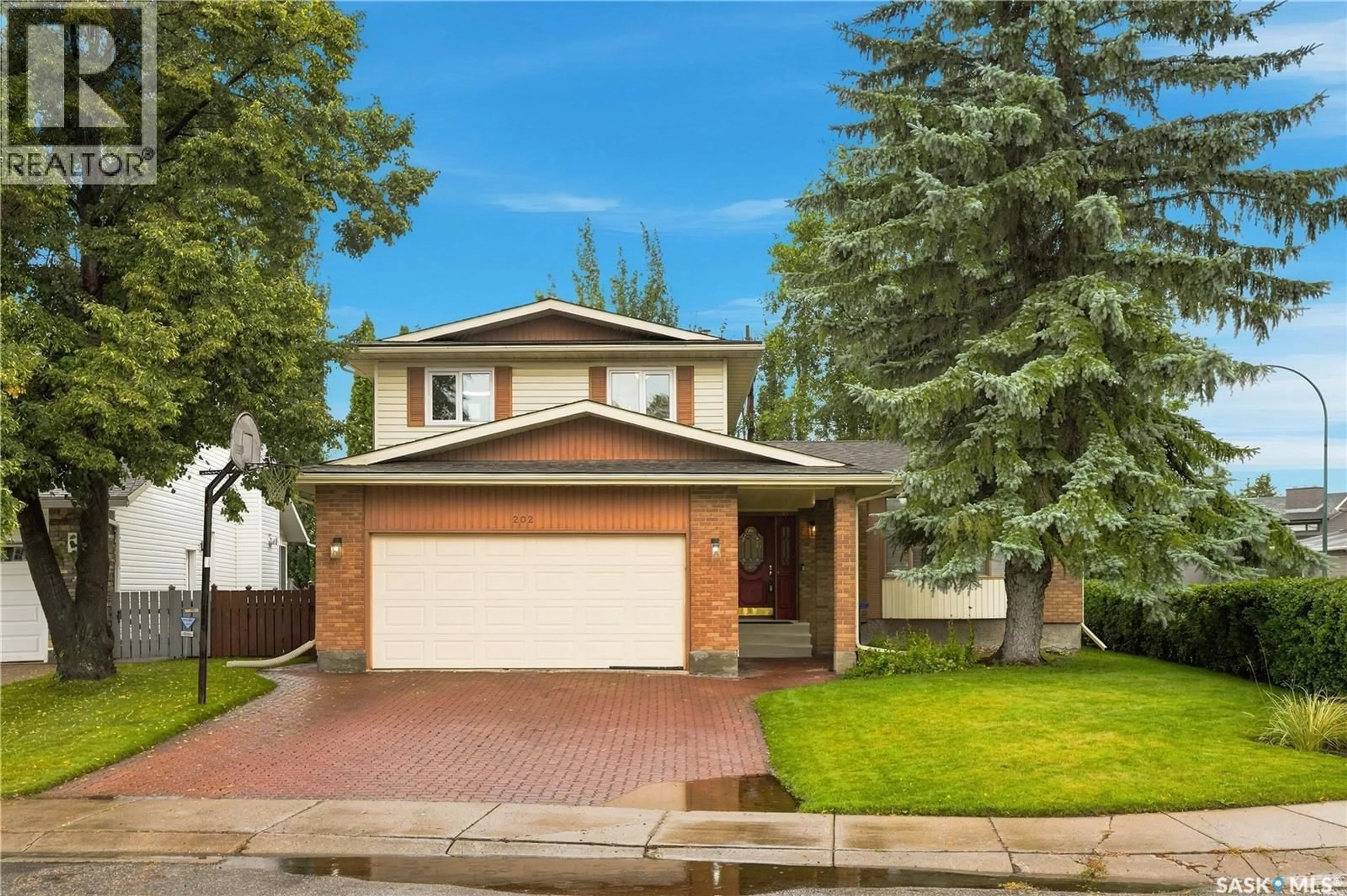 Home with vinyl exterior material, street for 202 ZEMAN COURT, Saskatoon Saskatchewan S7K7W5
