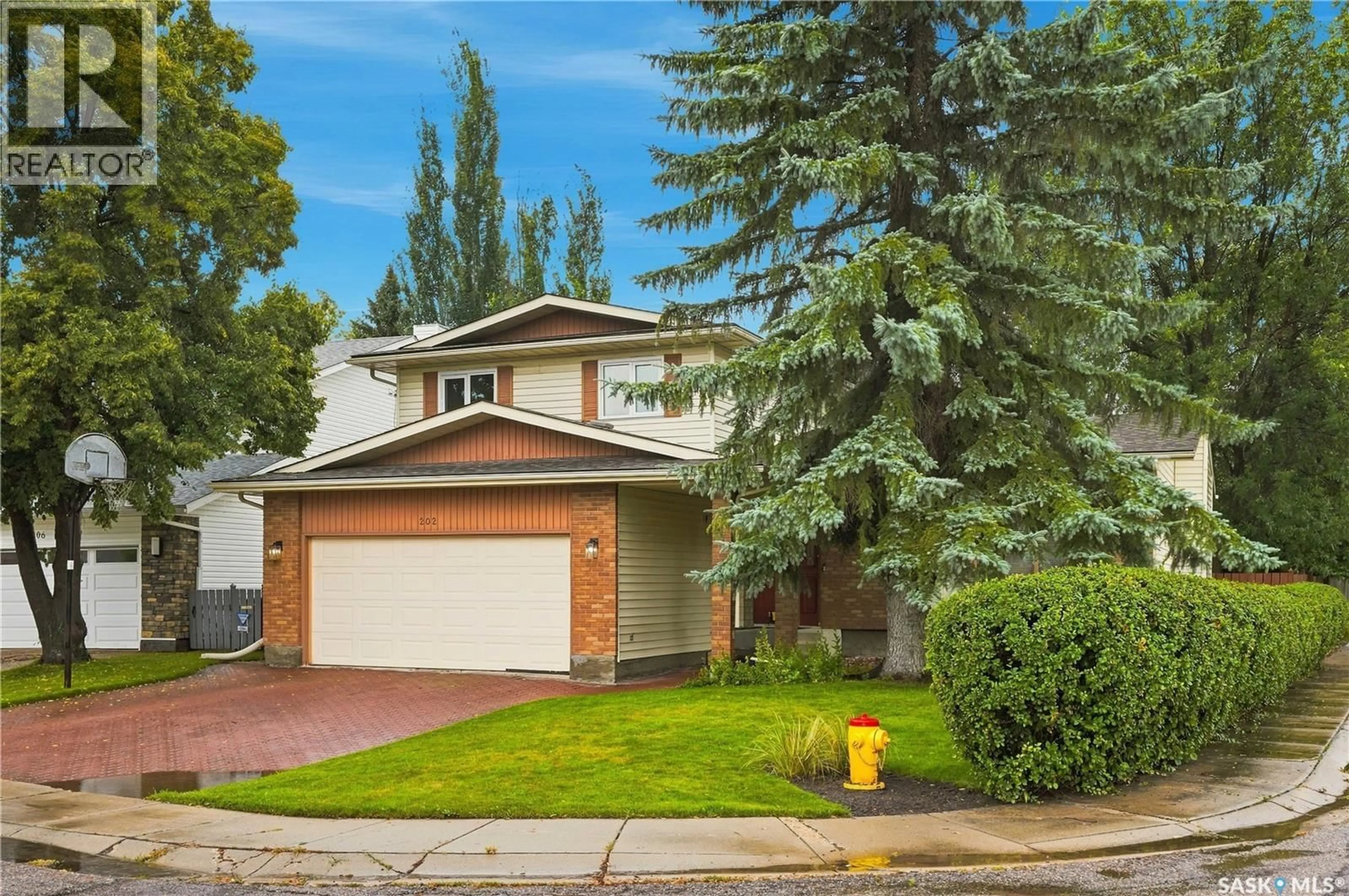 Home with vinyl exterior material, street for 202 ZEMAN COURT, Saskatoon Saskatchewan S7K7W5