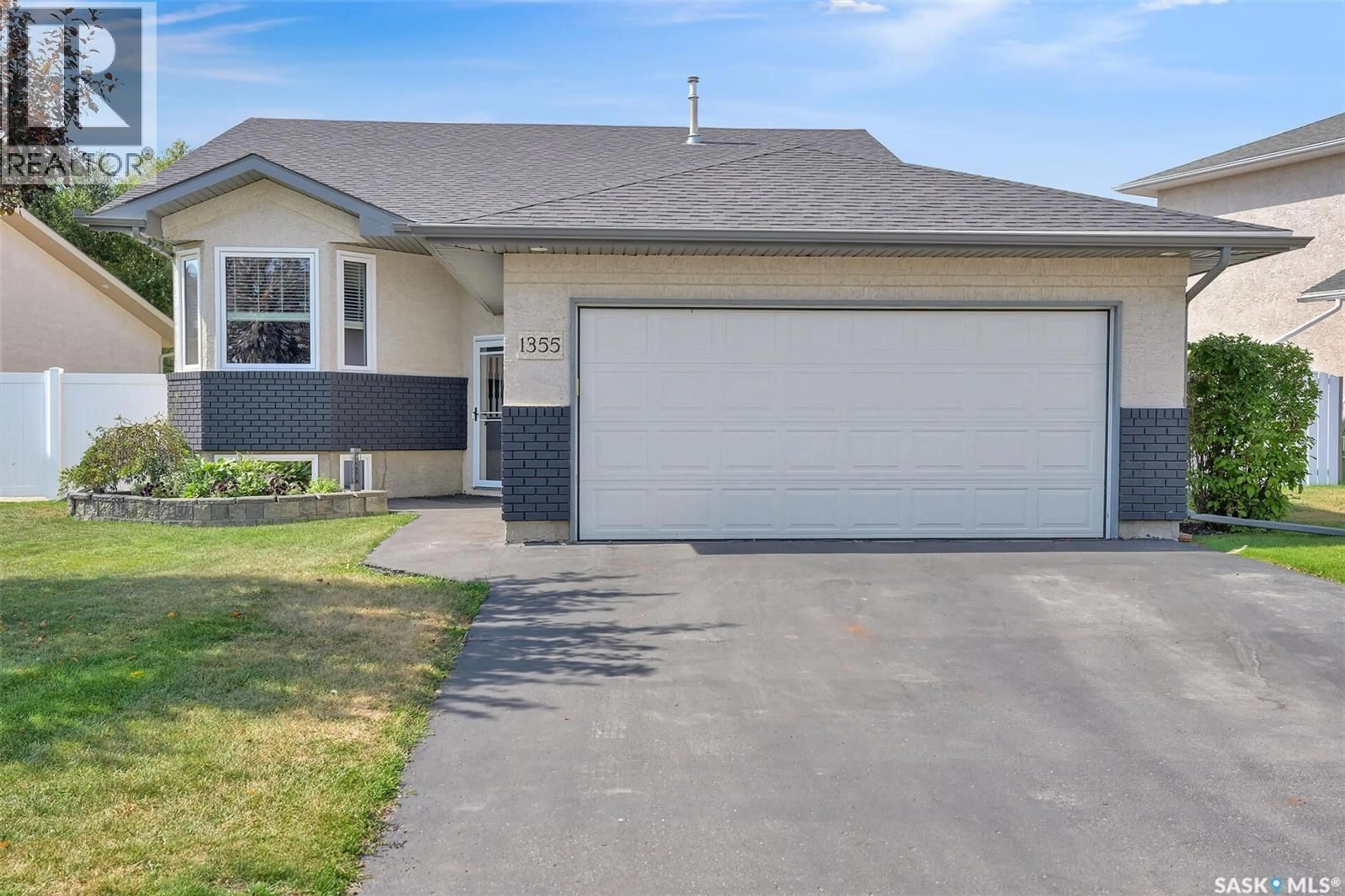 Home with vinyl exterior material, street for 1355 MAPLE LEAF CRESCENT, Regina Saskatchewan S4X4J4