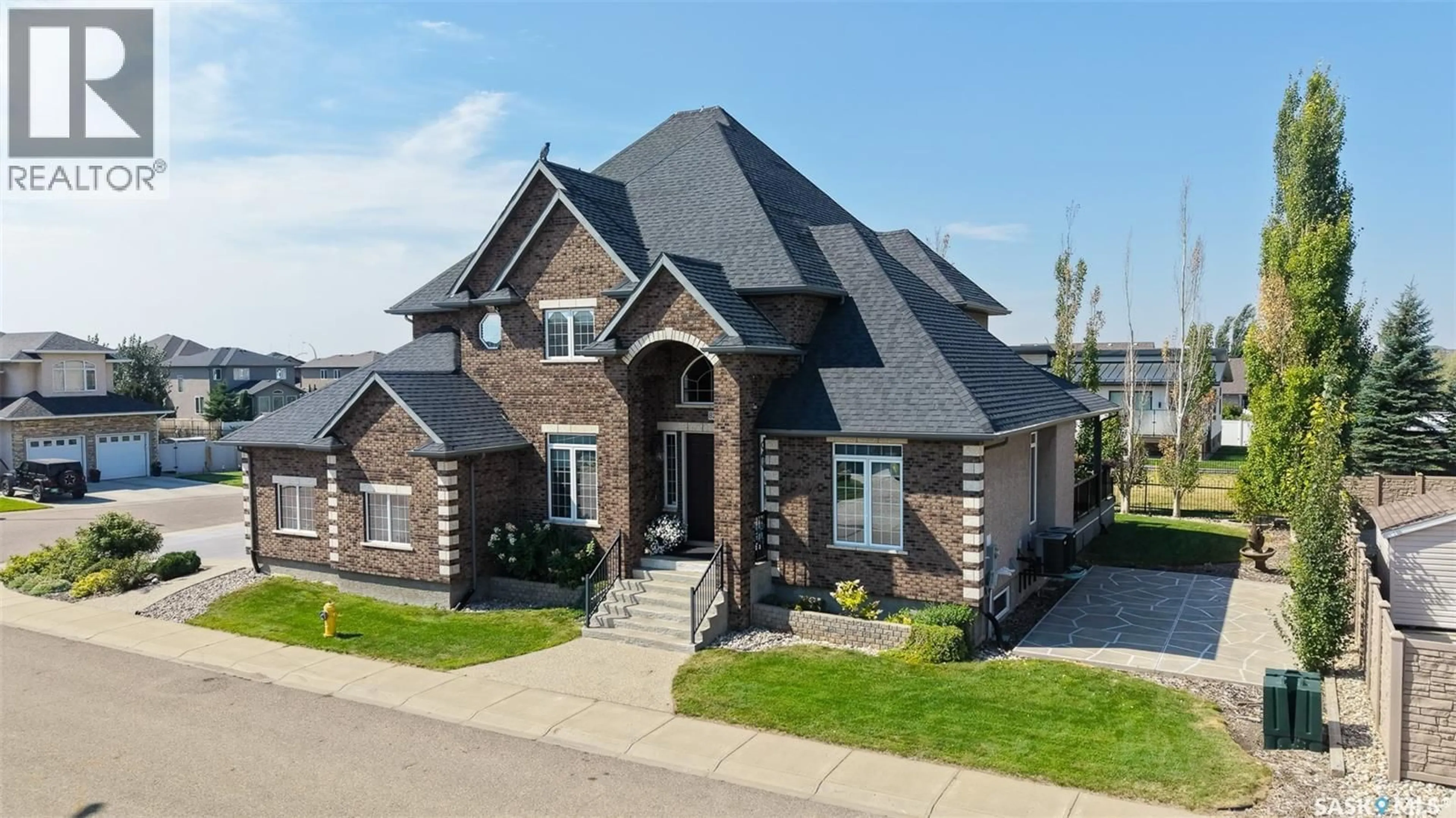 Home with brick exterior material, unknown for 8259 WASCANA GARDENS POINT, Regina Saskatchewan S4V1G8