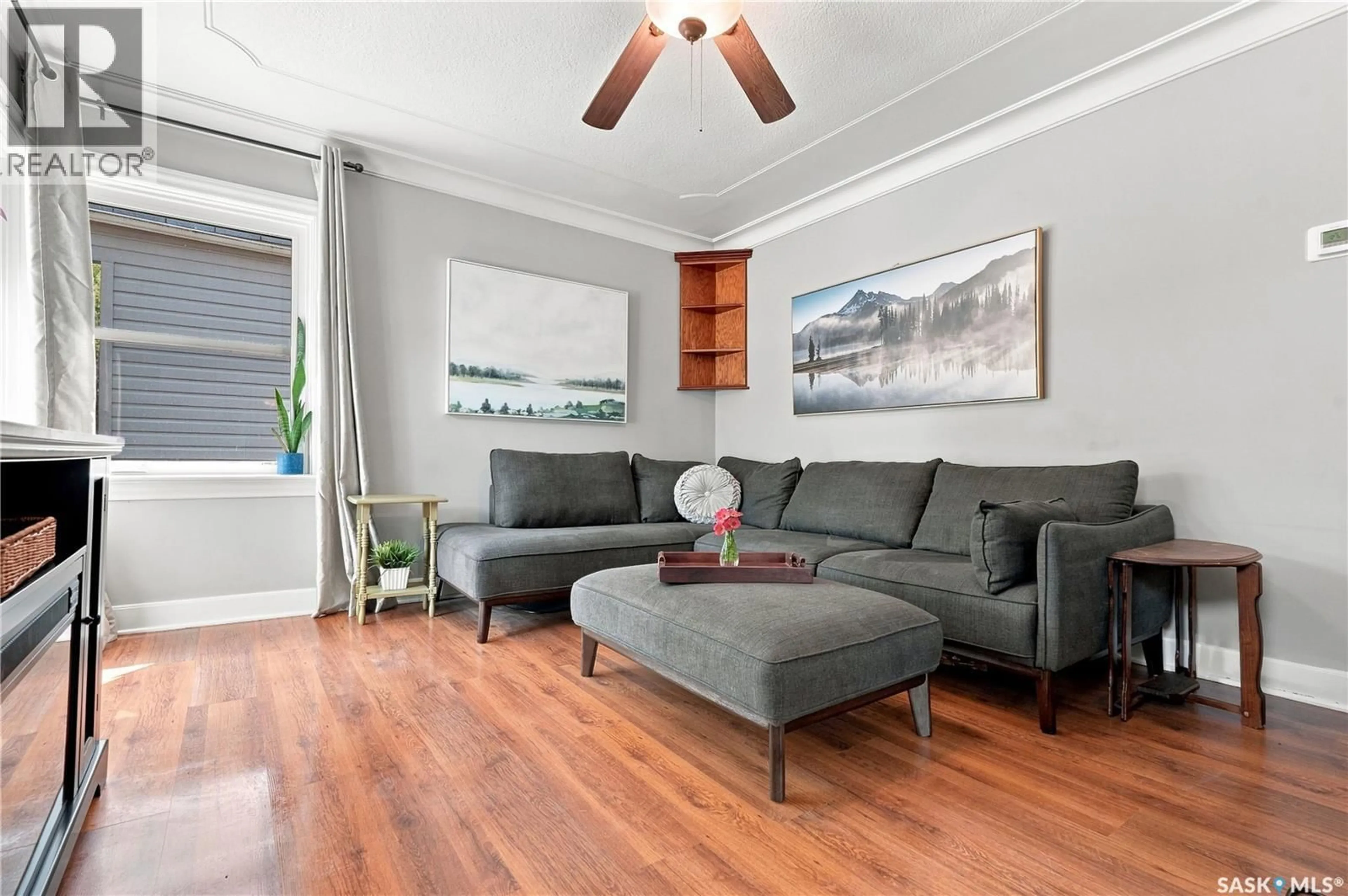 Living room with furniture, wood/laminate floor for 1502 LORNE AVENUE, Saskatoon Saskatchewan S7H1Y1