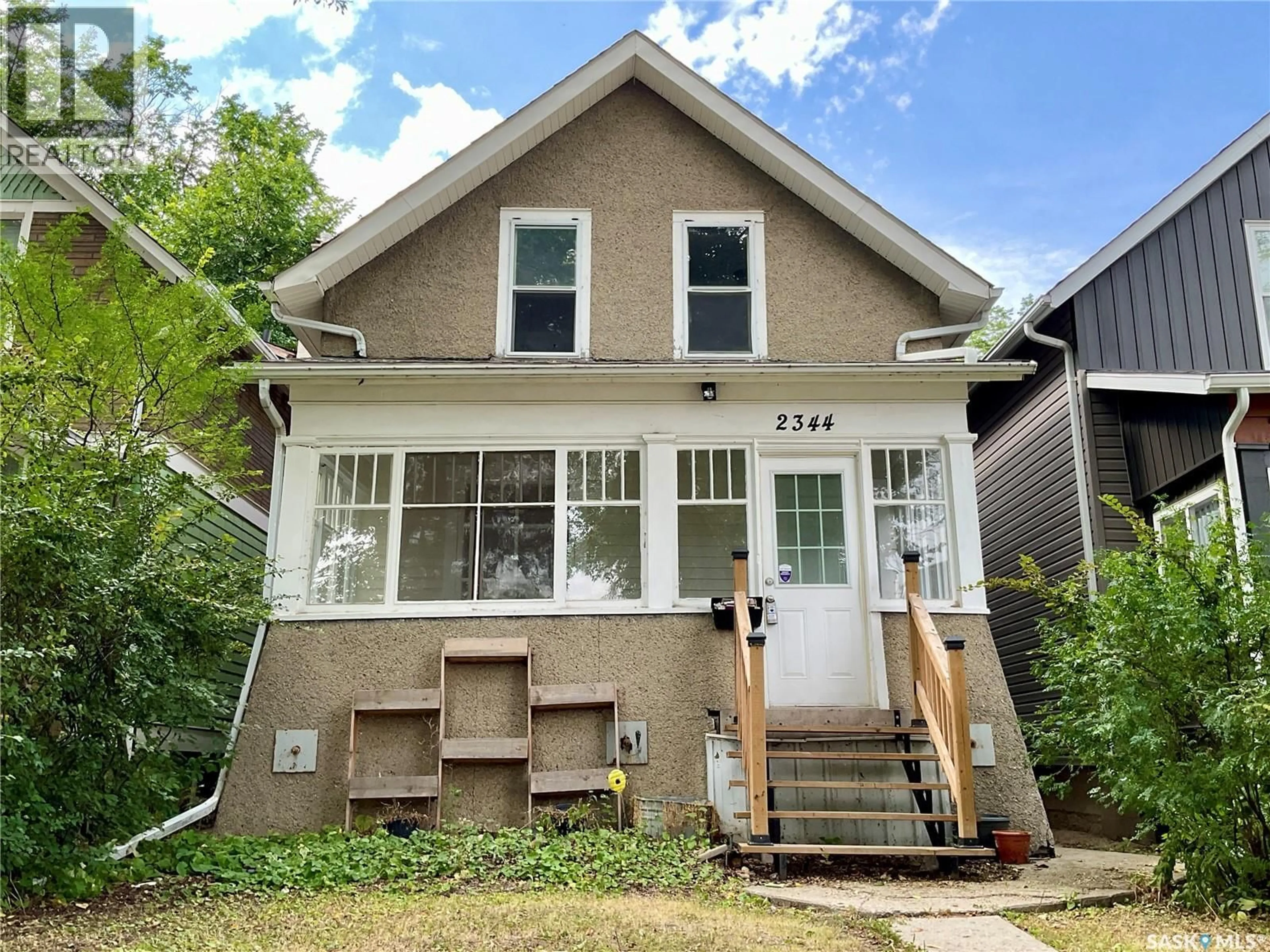 Home with vinyl exterior material, street for 2344 TORONTO STREET, Regina Saskatchewan S4P1N6