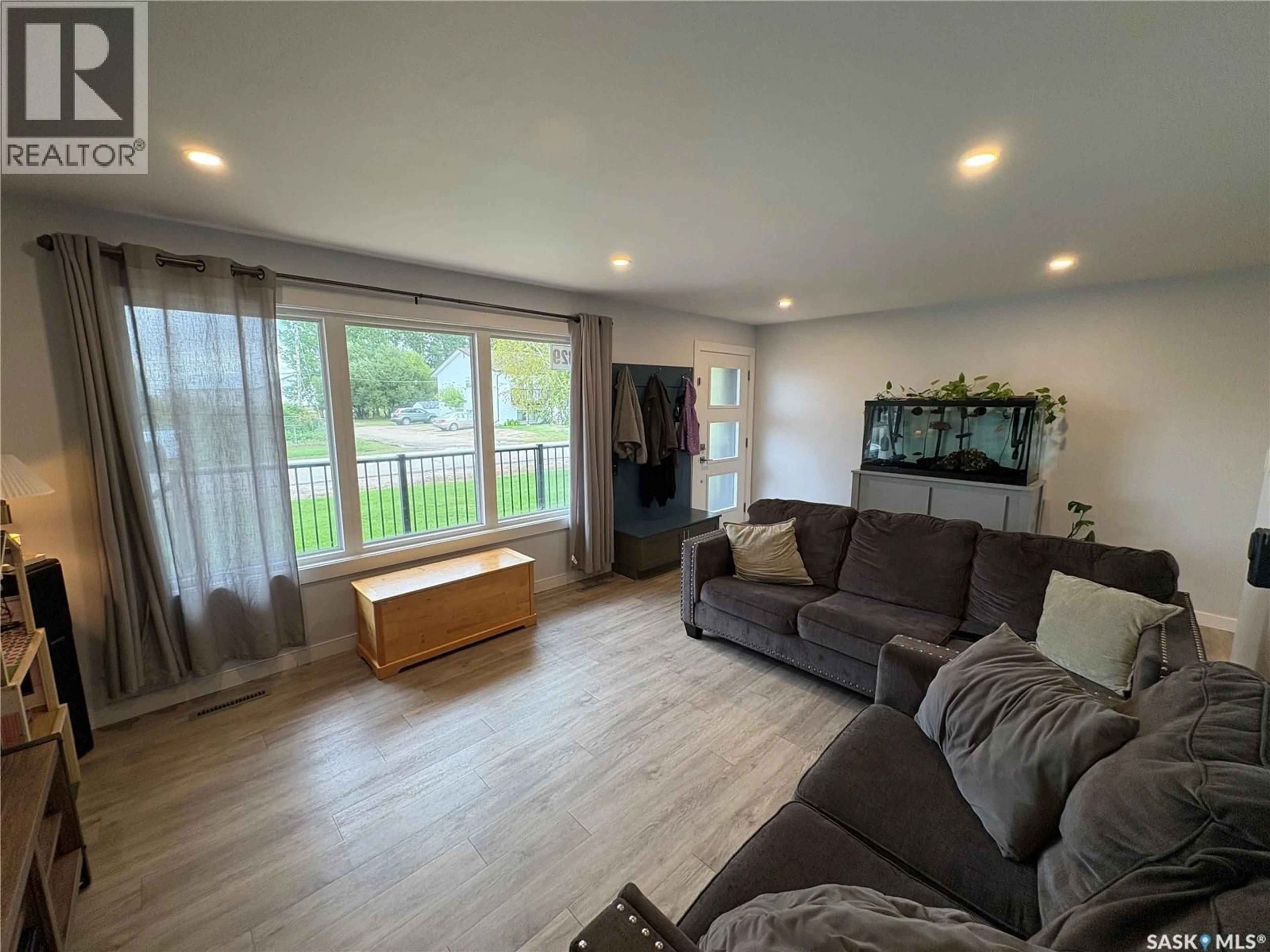 Living room with furniture, wood/laminate floor for 329 PROTHERO AVENUE, Churchbridge Saskatchewan S0A0M0